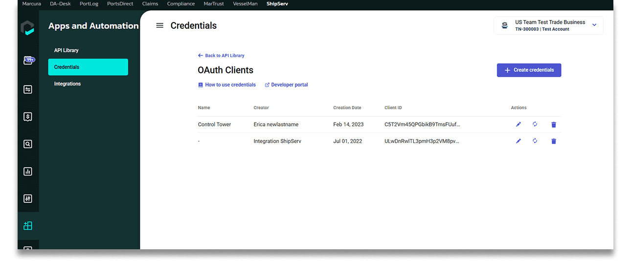 A crew member in an orange suit approaches a large cargo ship while others climb the side of the vessel.