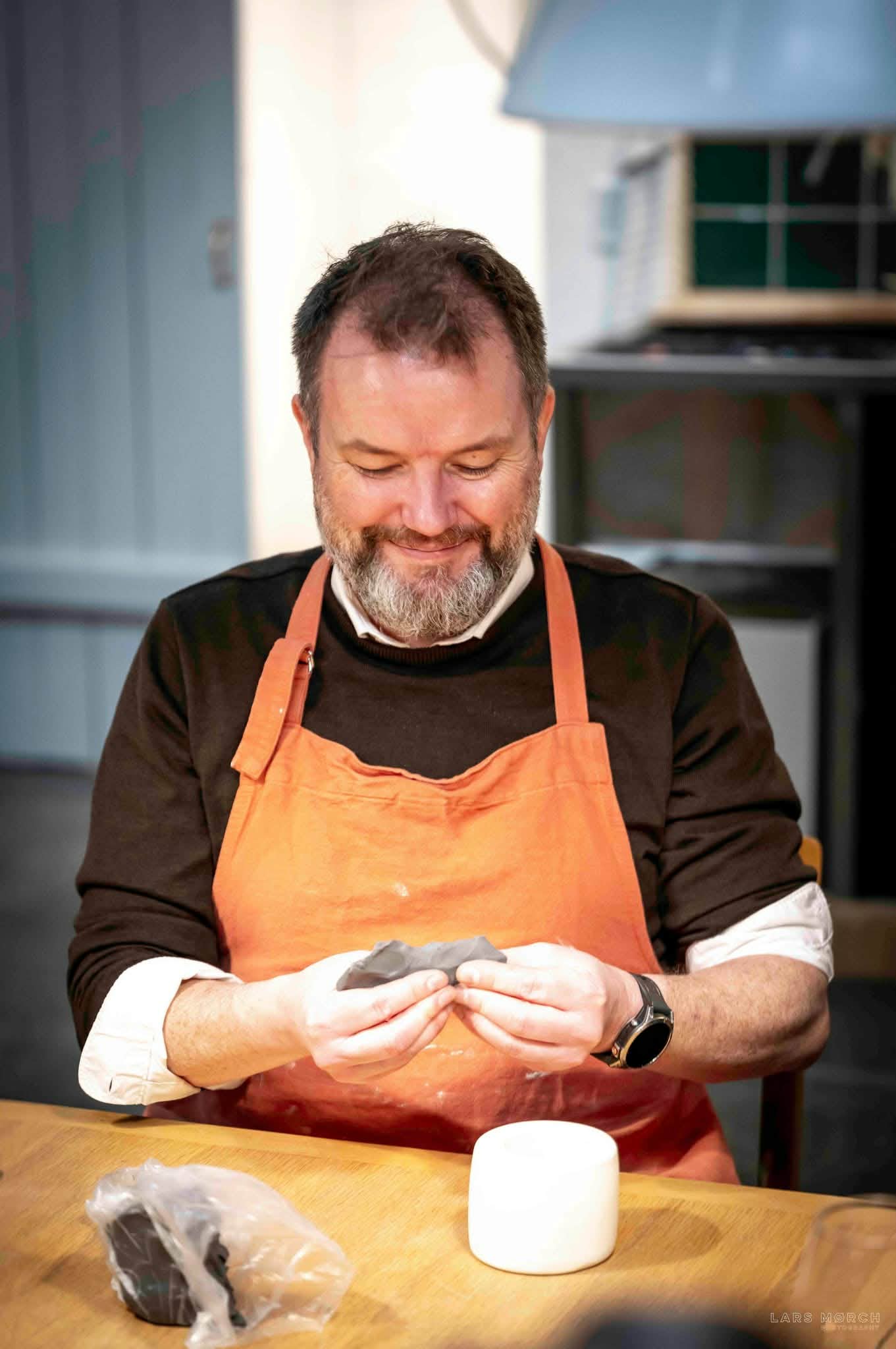 shaping clay with a casting form