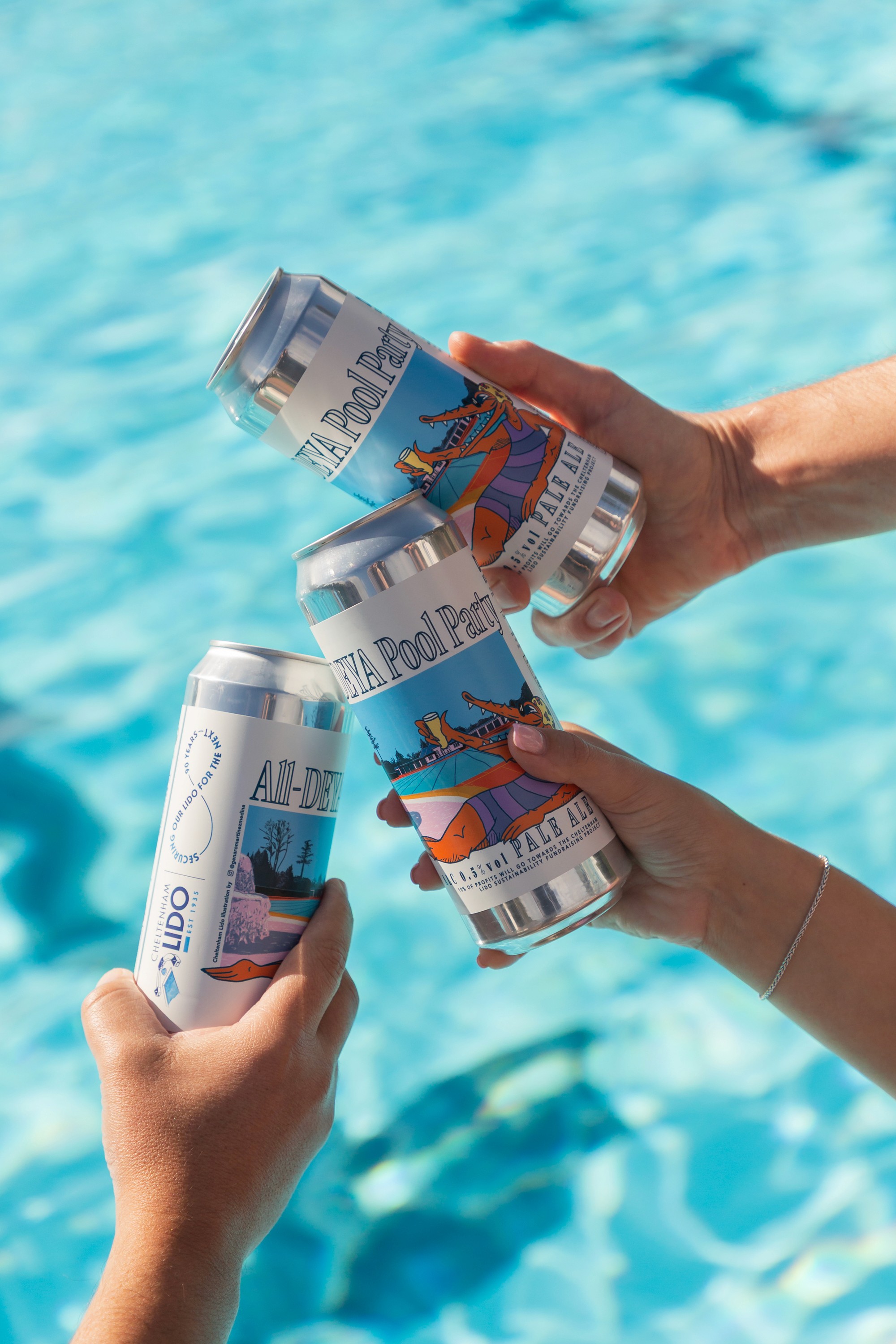White branded cap with turquoise logo placed on fresh lemons in a red bowl