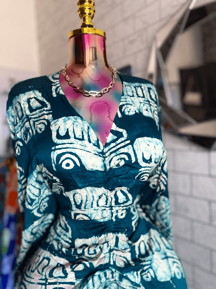 a brown leather chair sitting in front of a window