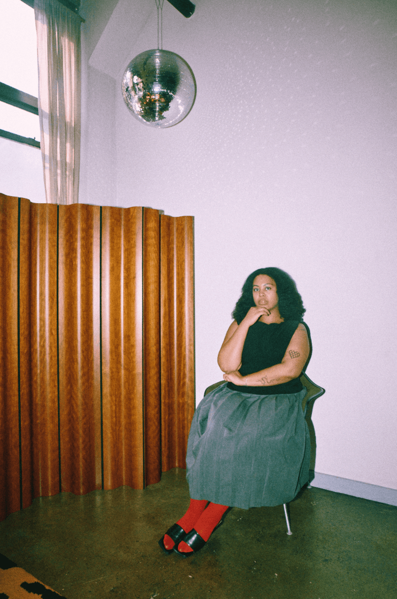 American flag flying against a cloudy sky
