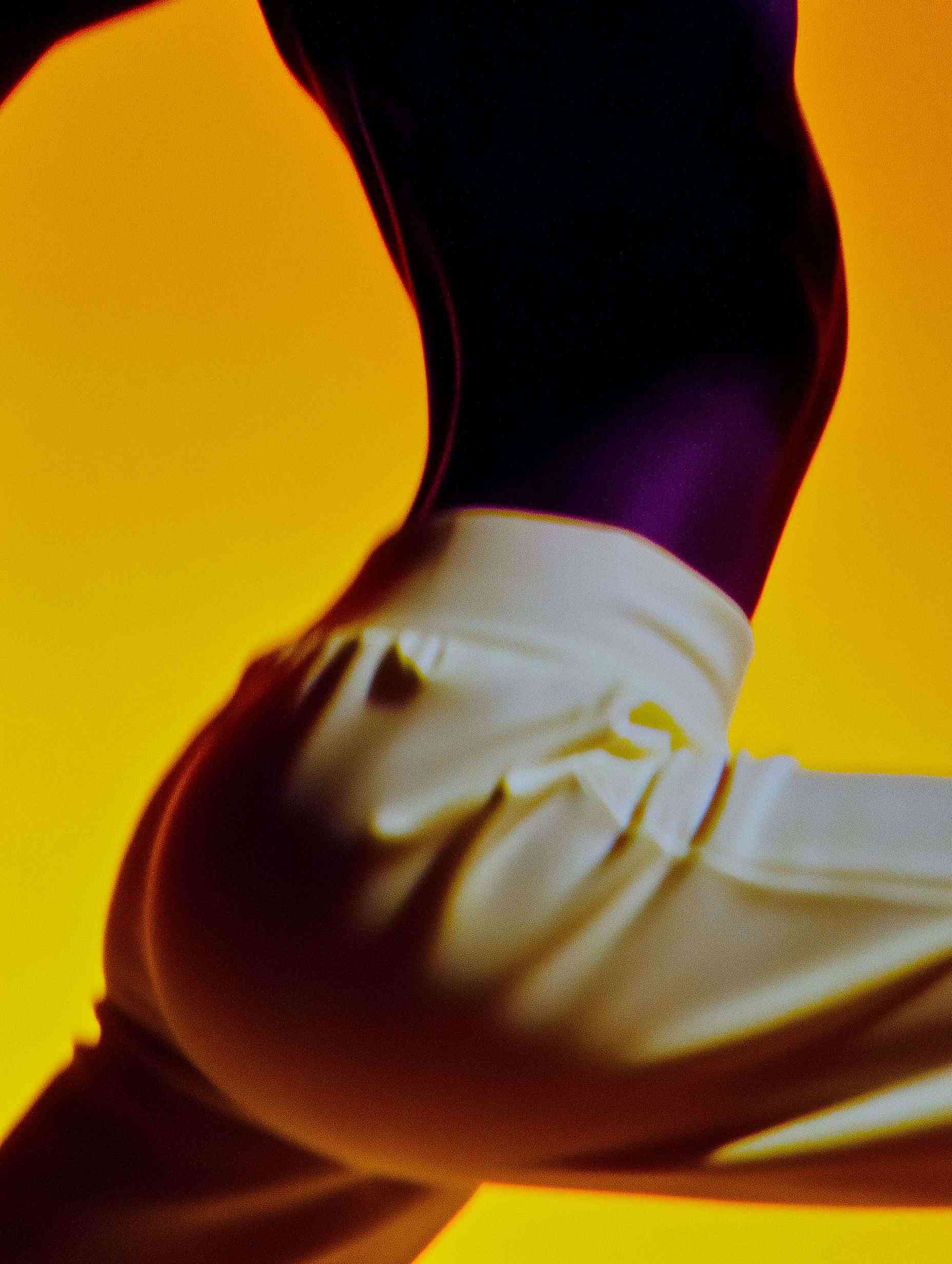 Athletic woman's leg in purple-blue