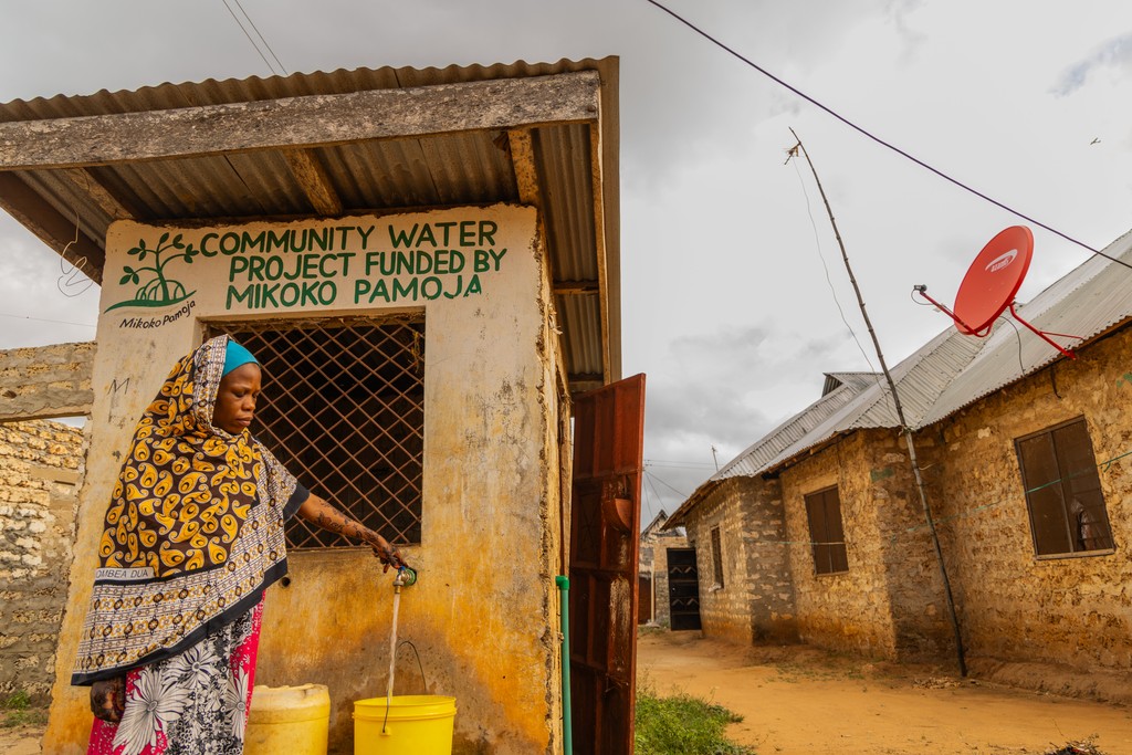 Woman at water point. Photo credit Anthony Ochieng Onyango