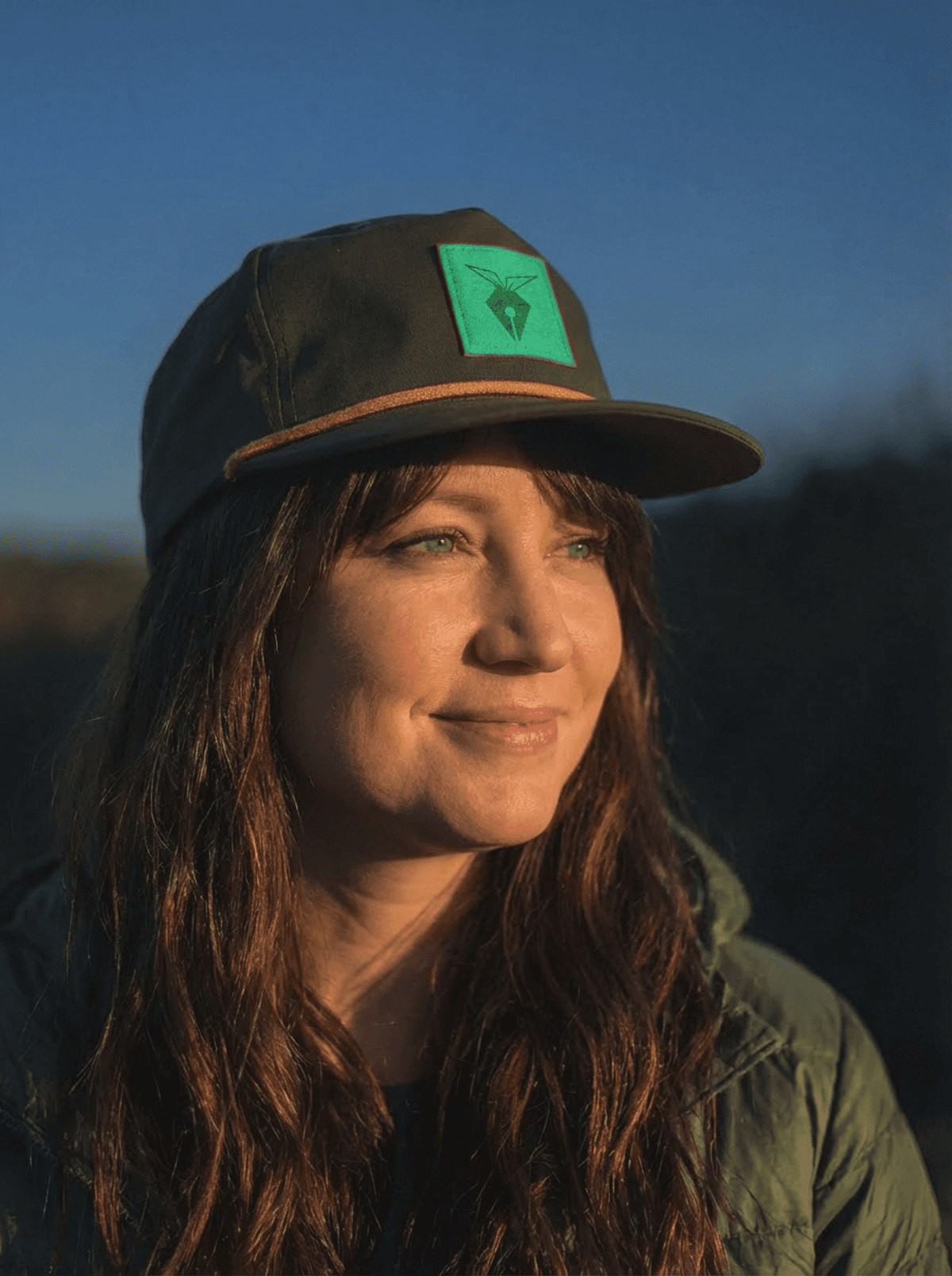 Profile portrait of a man in a white shirt against a light background