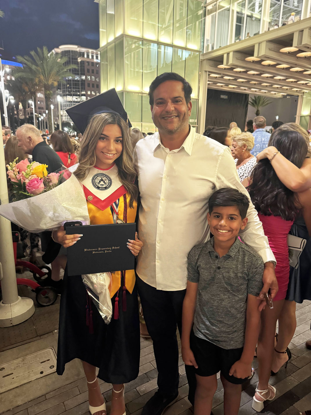 Kamran Farid accompanying his daughter at her graduation, along with his son.