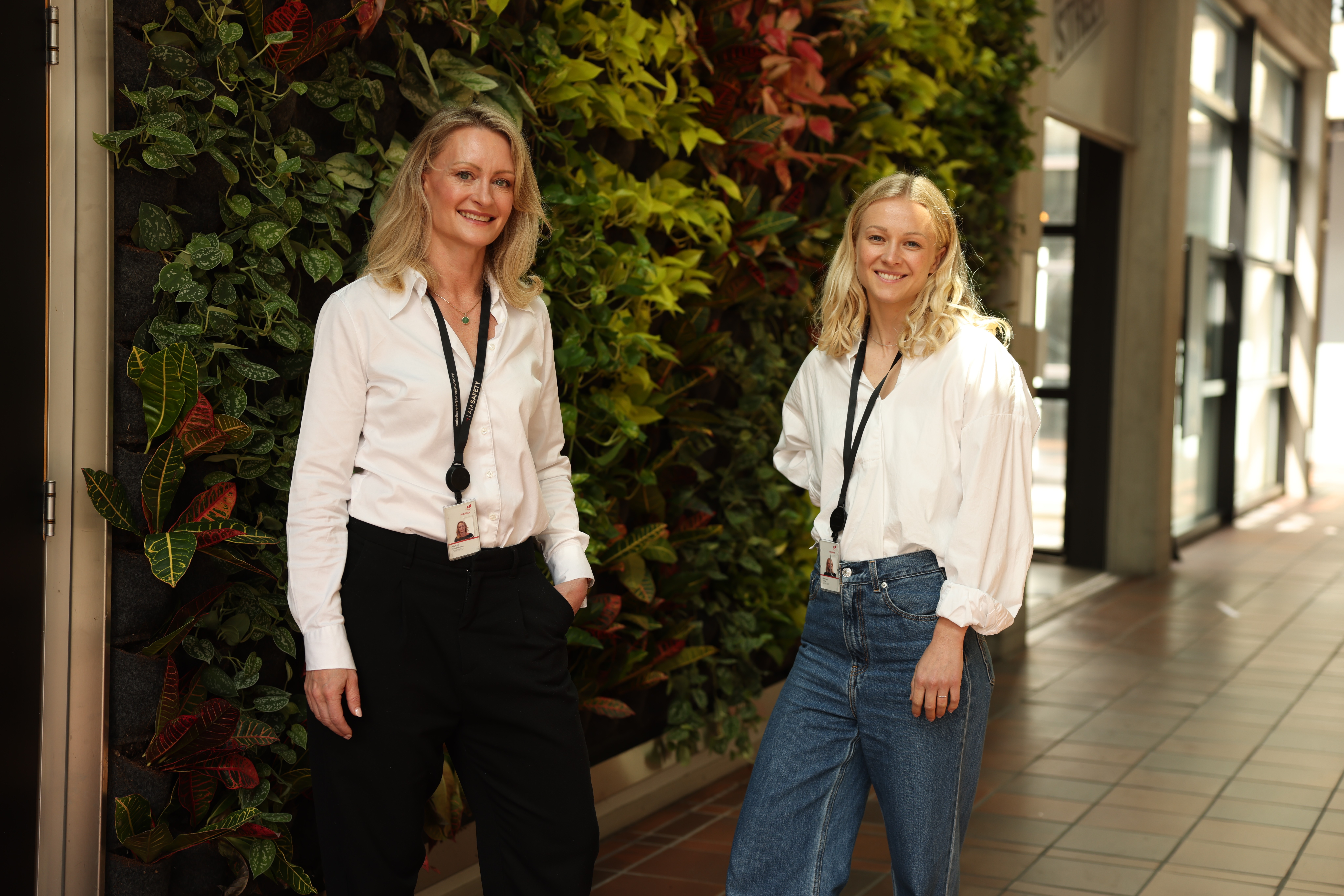 Two women in office smiling