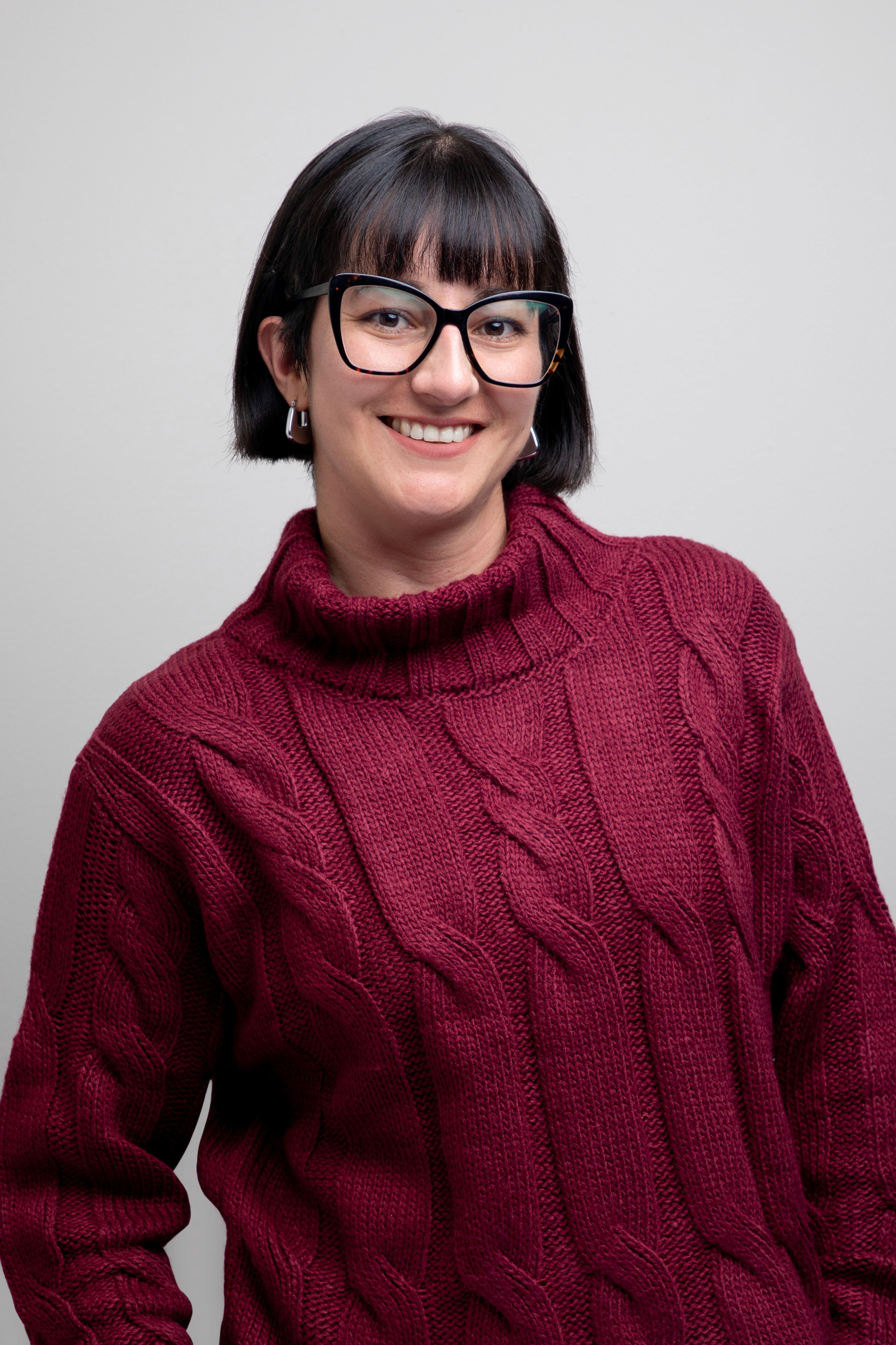 nerdy girl in glasses smiling