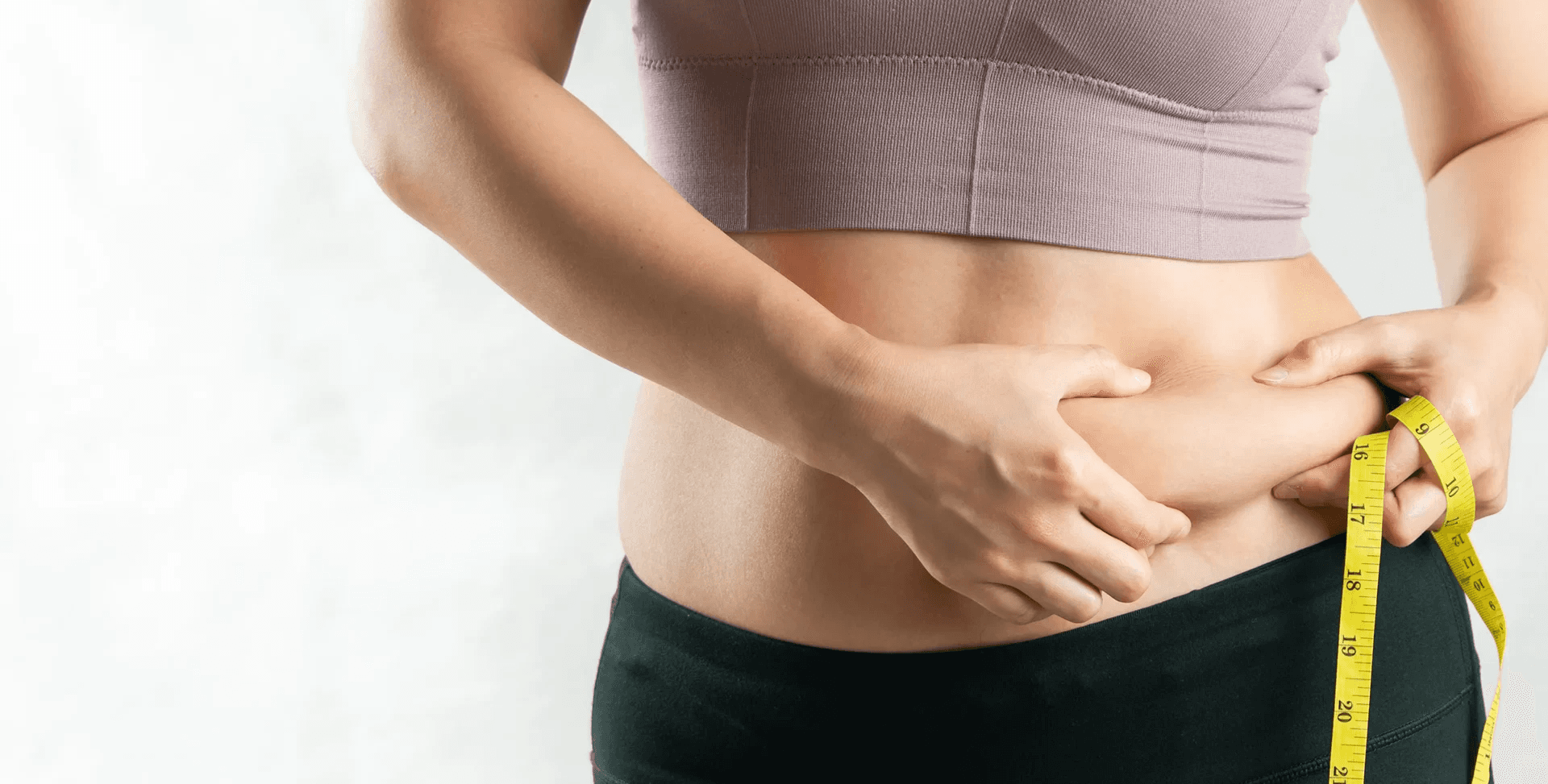 Woman measuring waist with tape -  Who Should Not Take Semaglutide