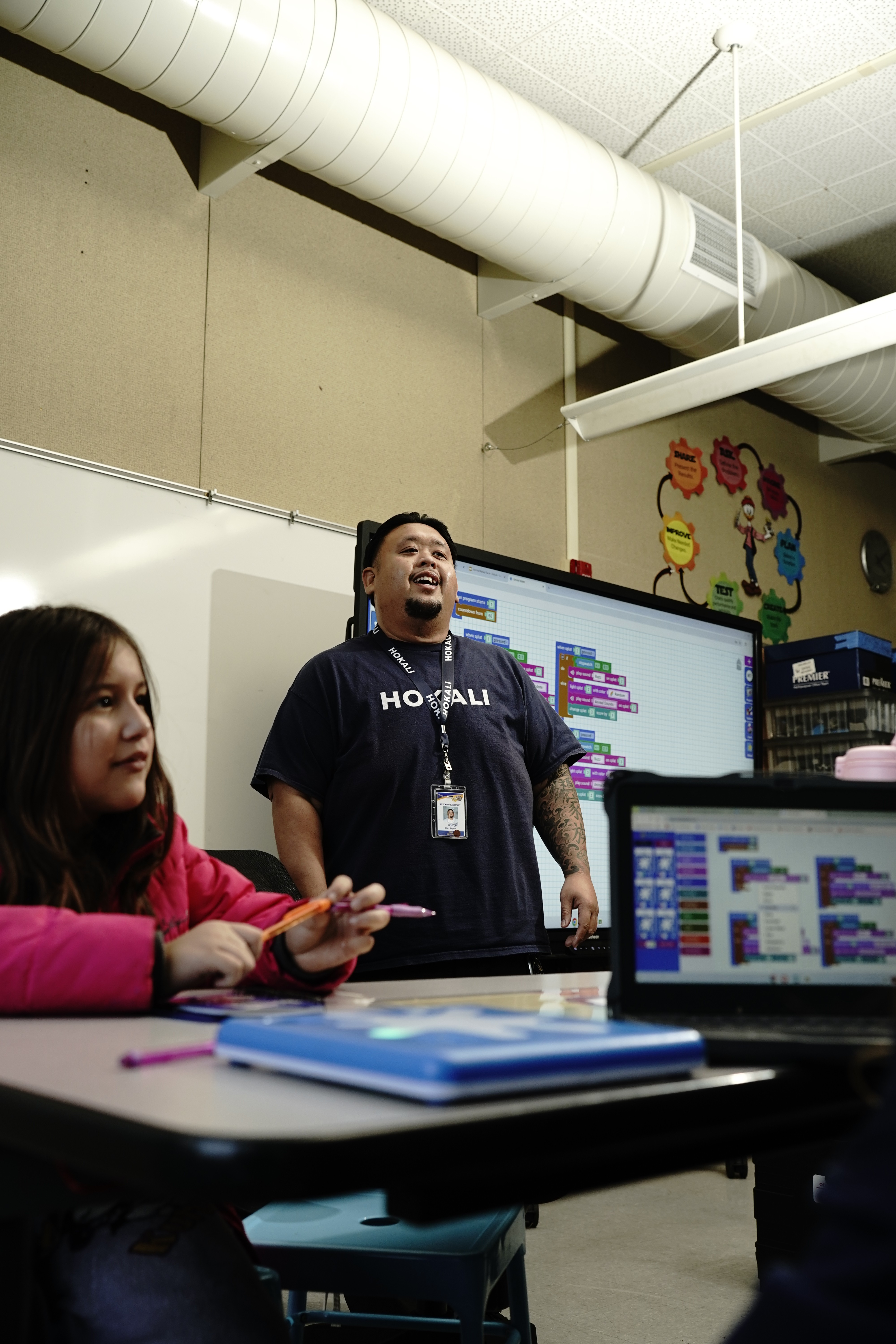 HOKALI educator leading a group activity at a summer camp focused on teamwork and confidence