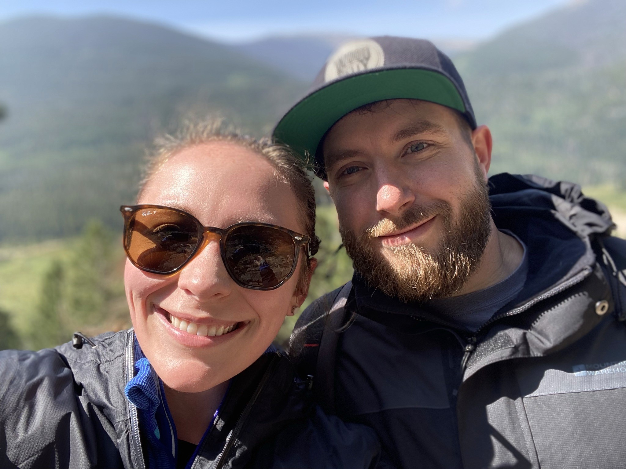 Three colorful cocktails with garnishes on a bar