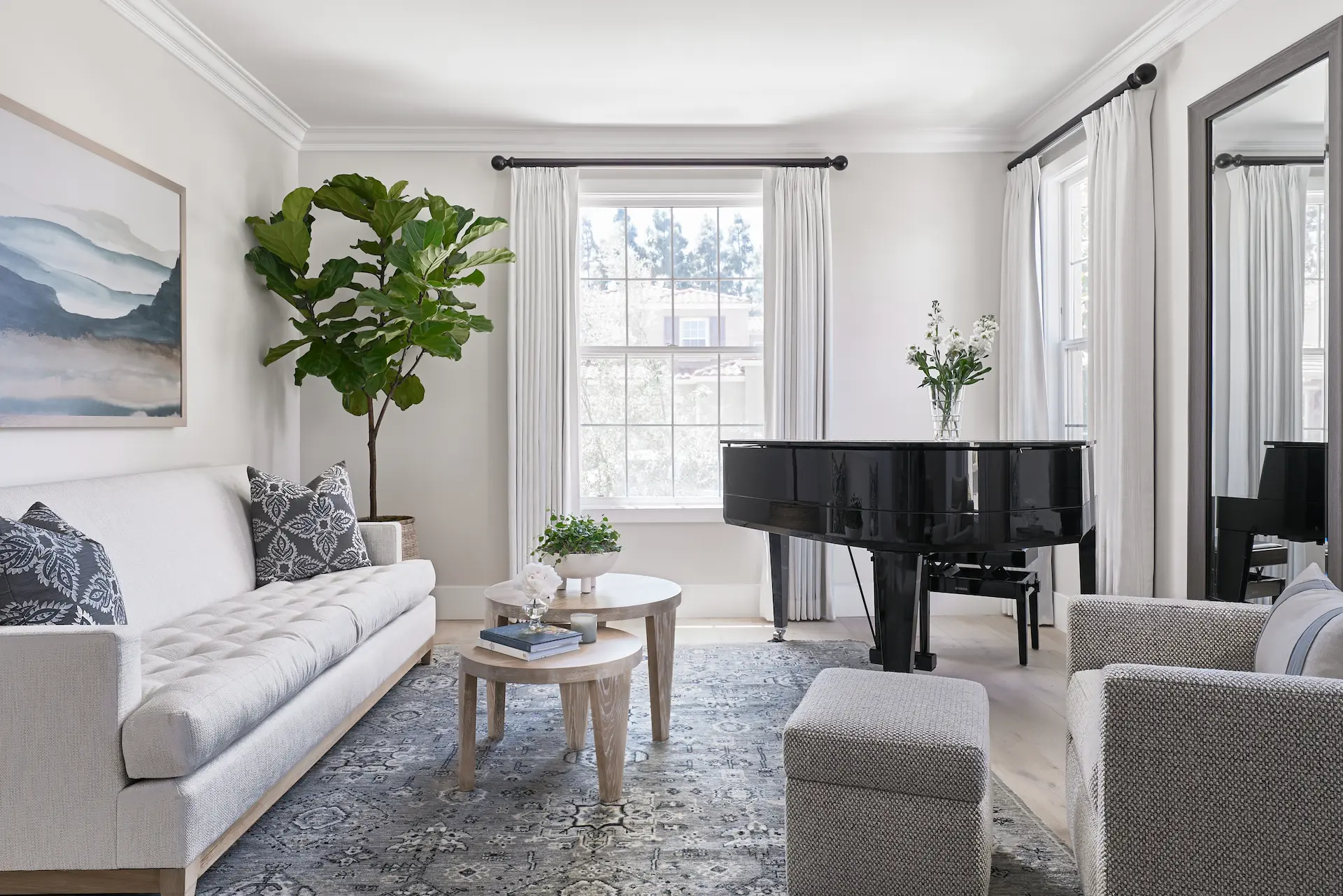 Wide-angle view from angle two of the living room, highlighting the piano and interior design in the Irvine Contemporary Coastal Remodel. Photo by Todd Huge.