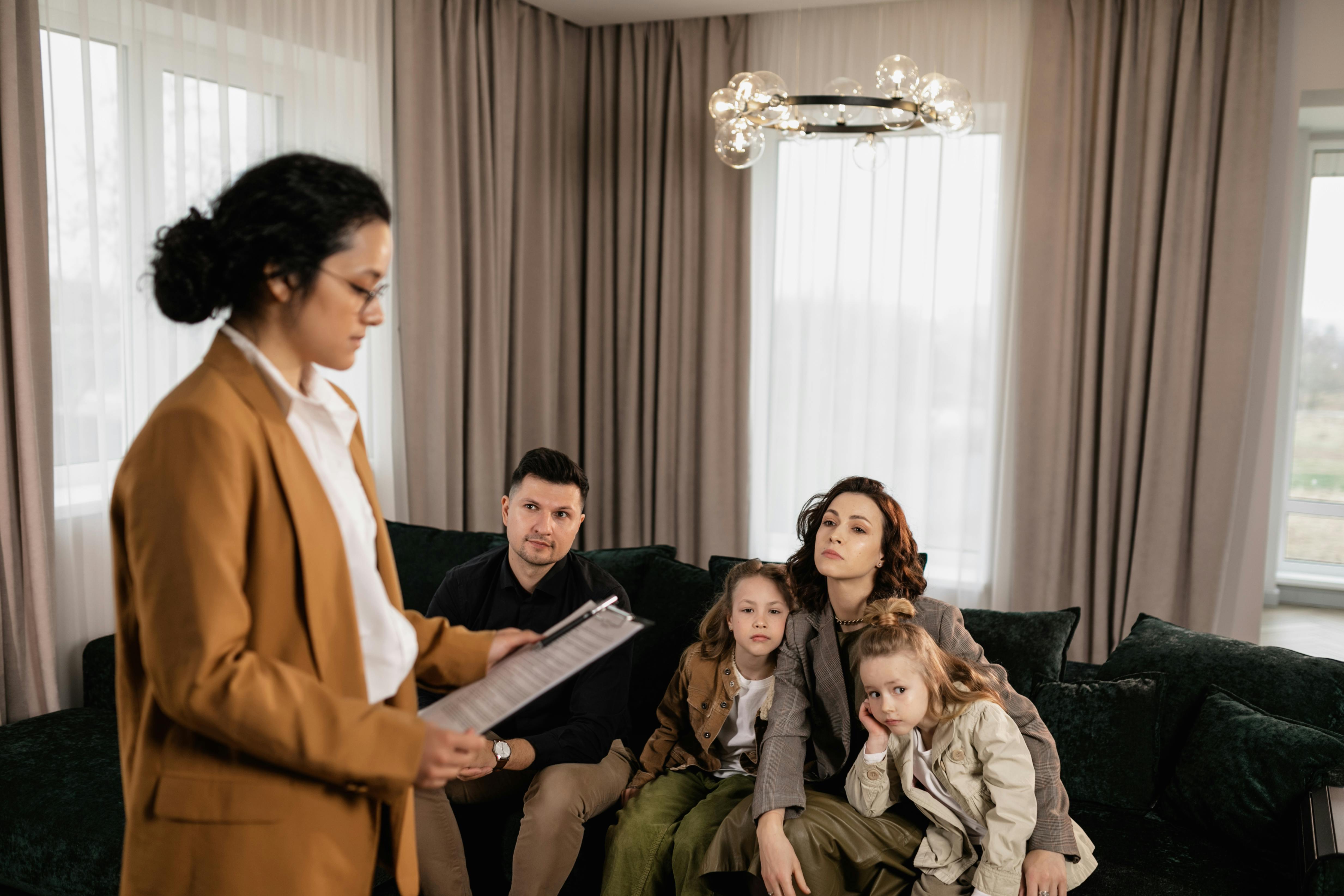 Conversion Truth for Families: Woman stsnding with a clipboard and speaking to a family sitting