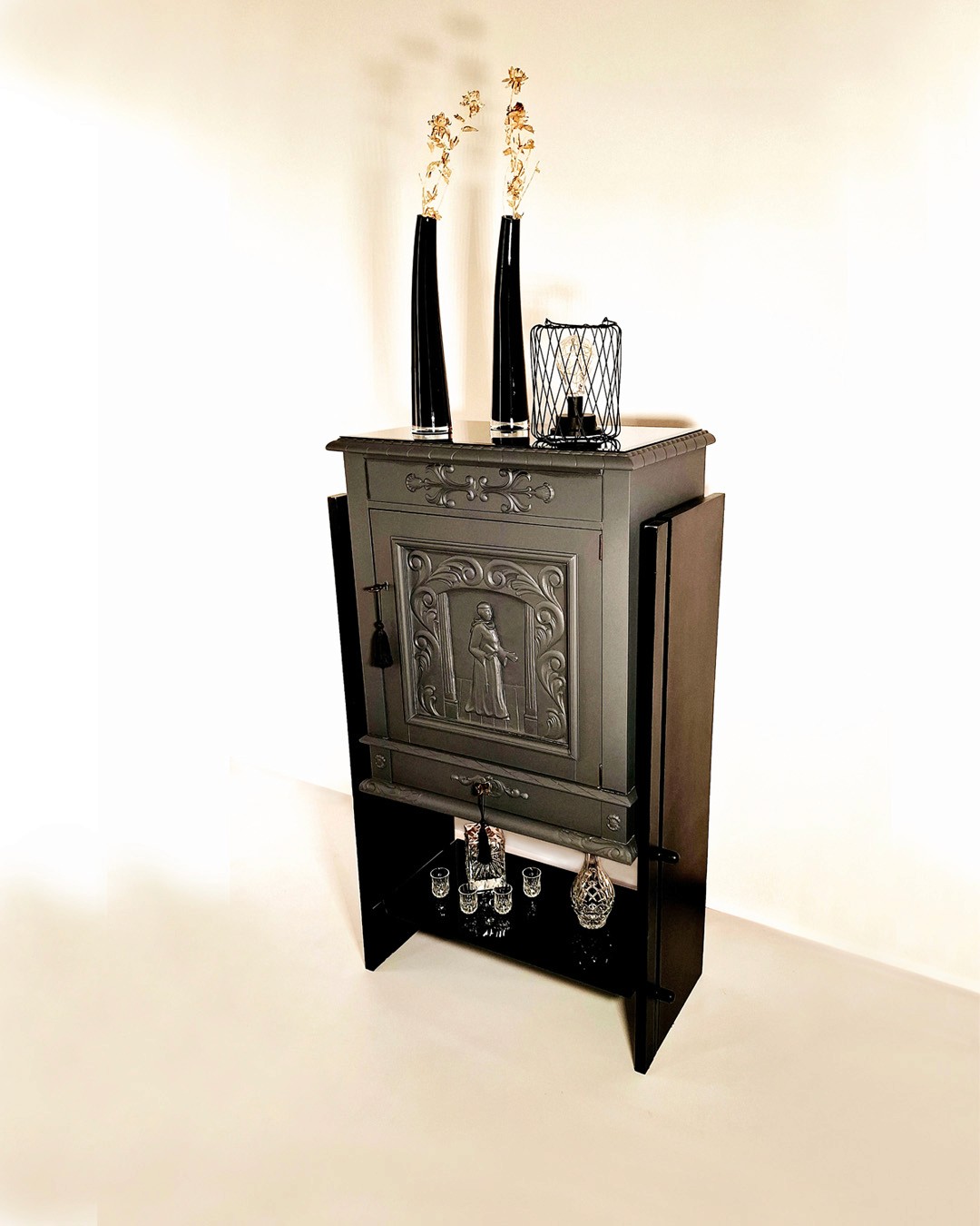 Dark Grey wood cabinet featuring sculpted monk figure and ornamental scrollwork, authentic antique furniture
