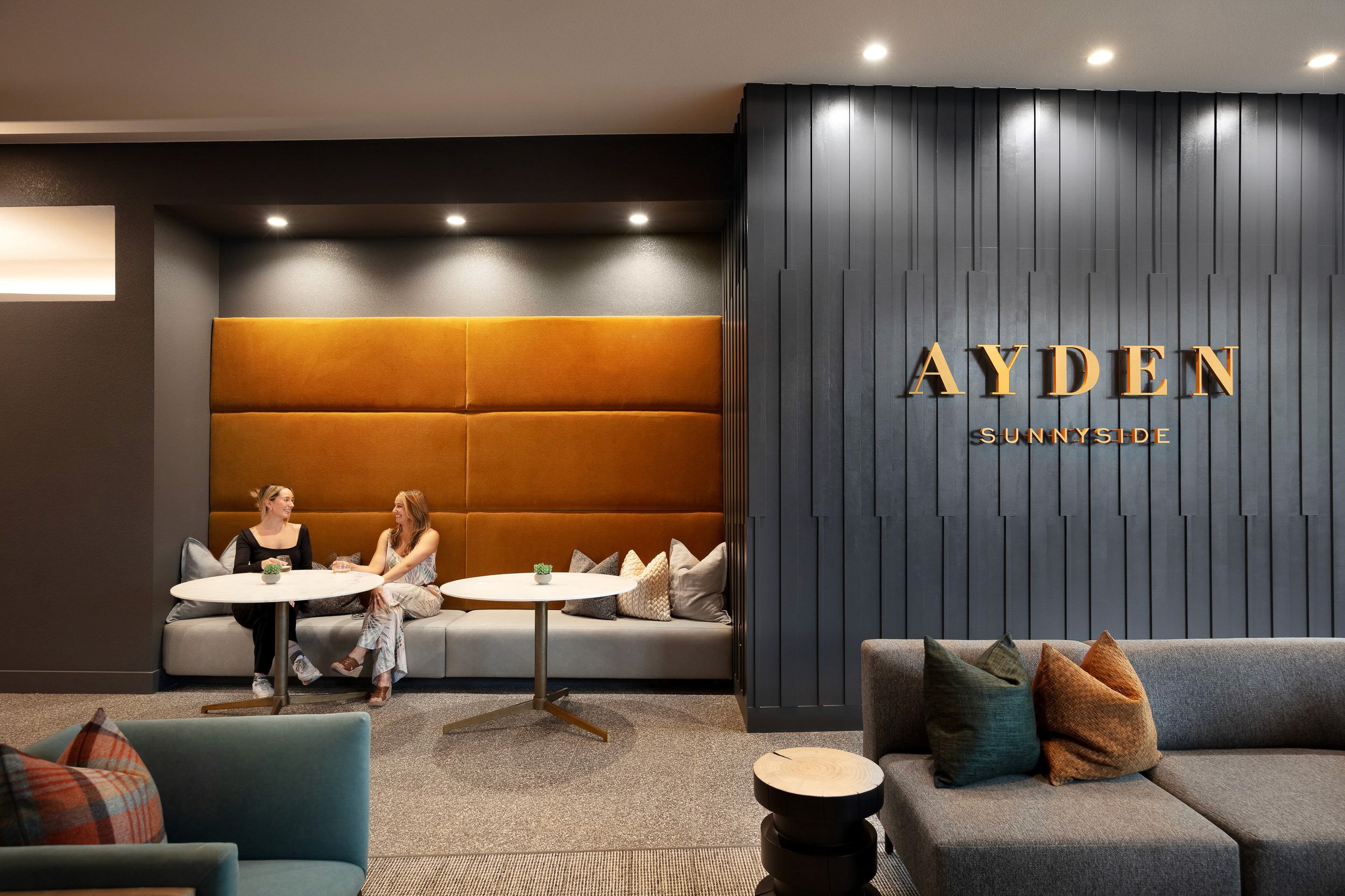 AYDEN SUNNYSIDE signage on a modern wall