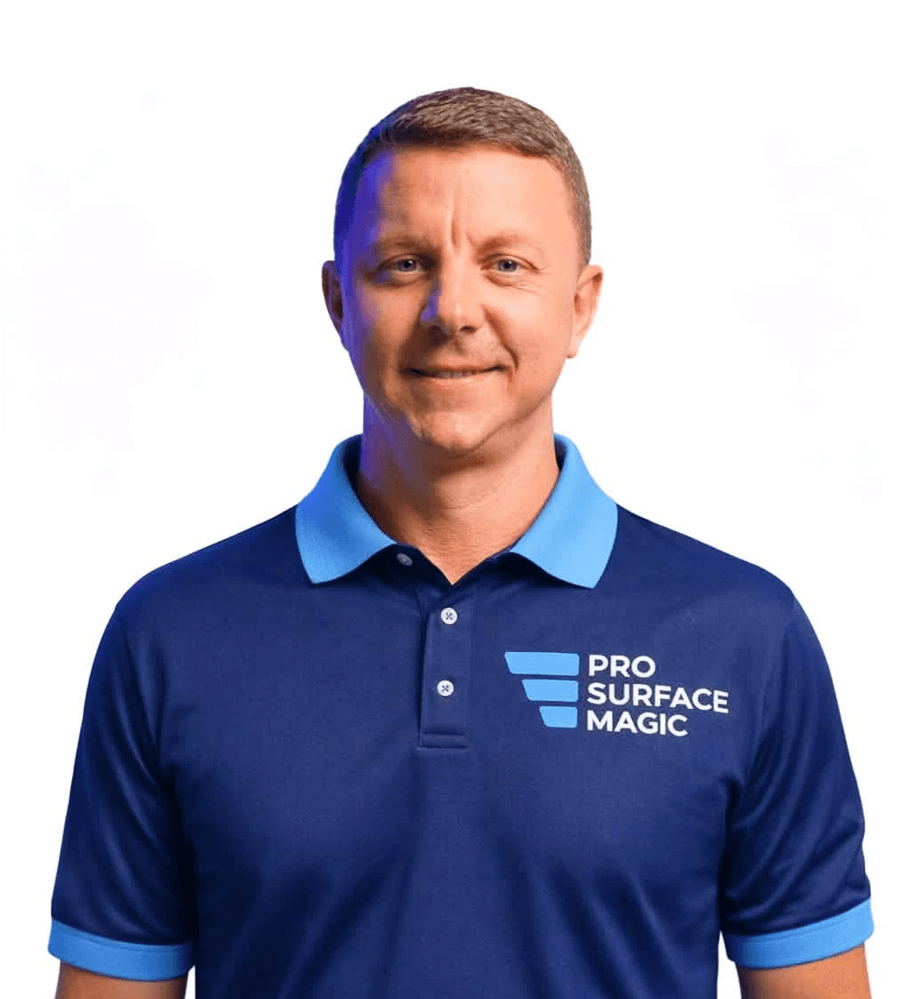 Man wearing a Pro Surface Magic branded polo shirt, smiling