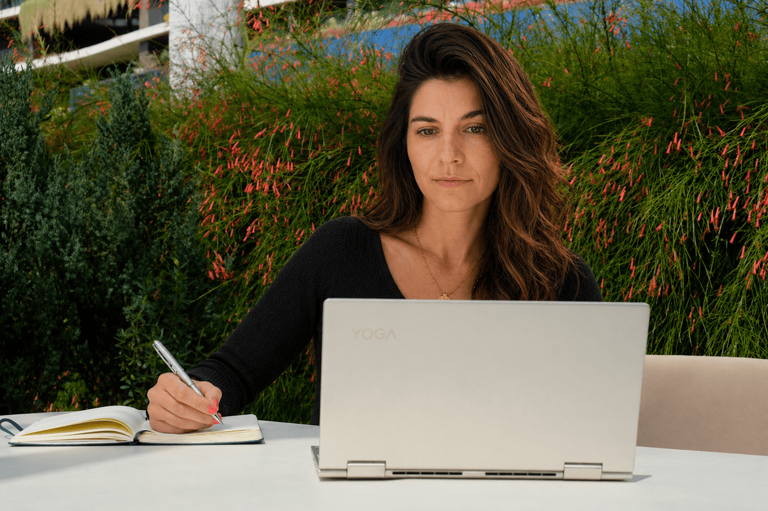 Diana Grobelny, ClickUp consultant, working at her laptop