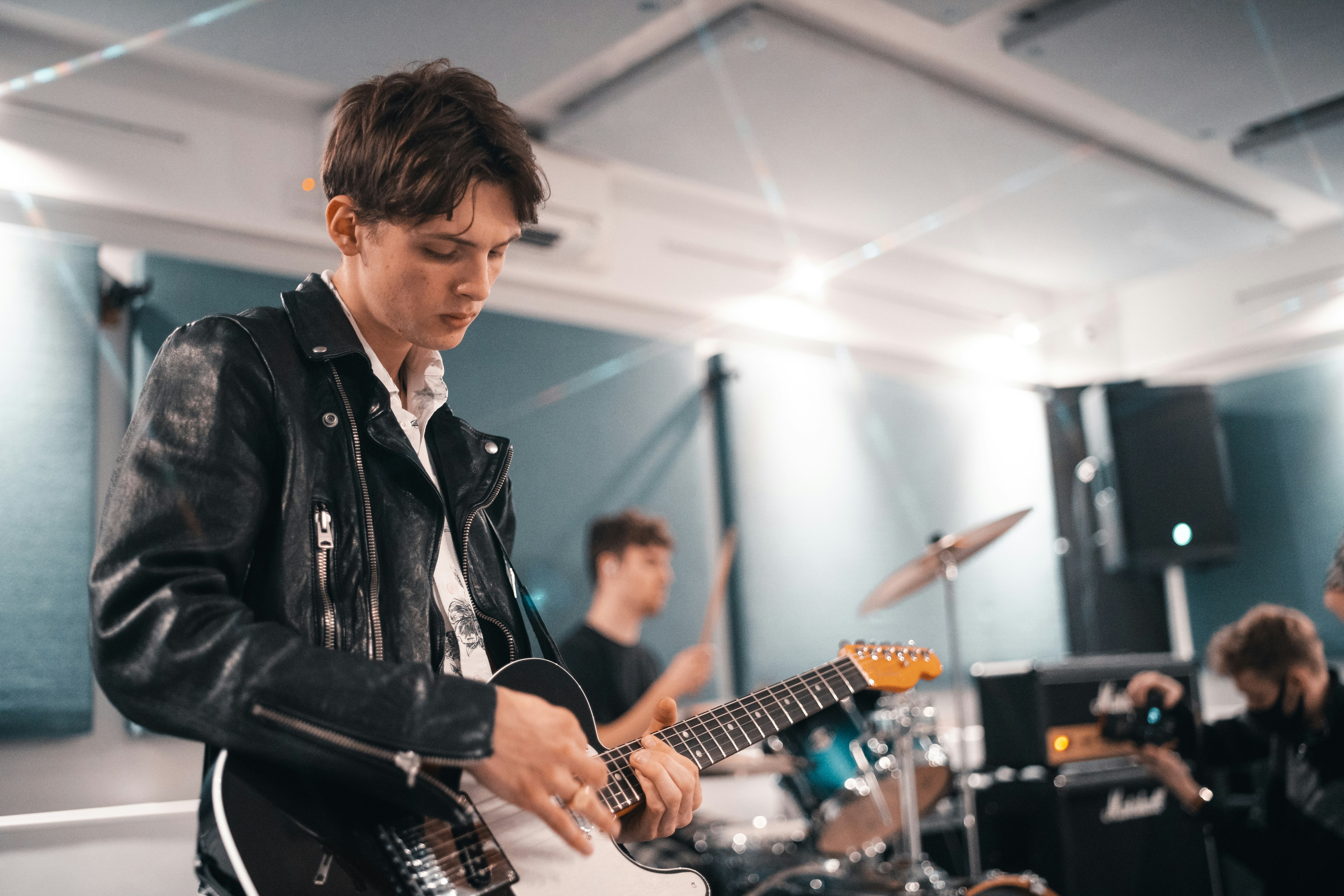 Guitar player practicing with the band