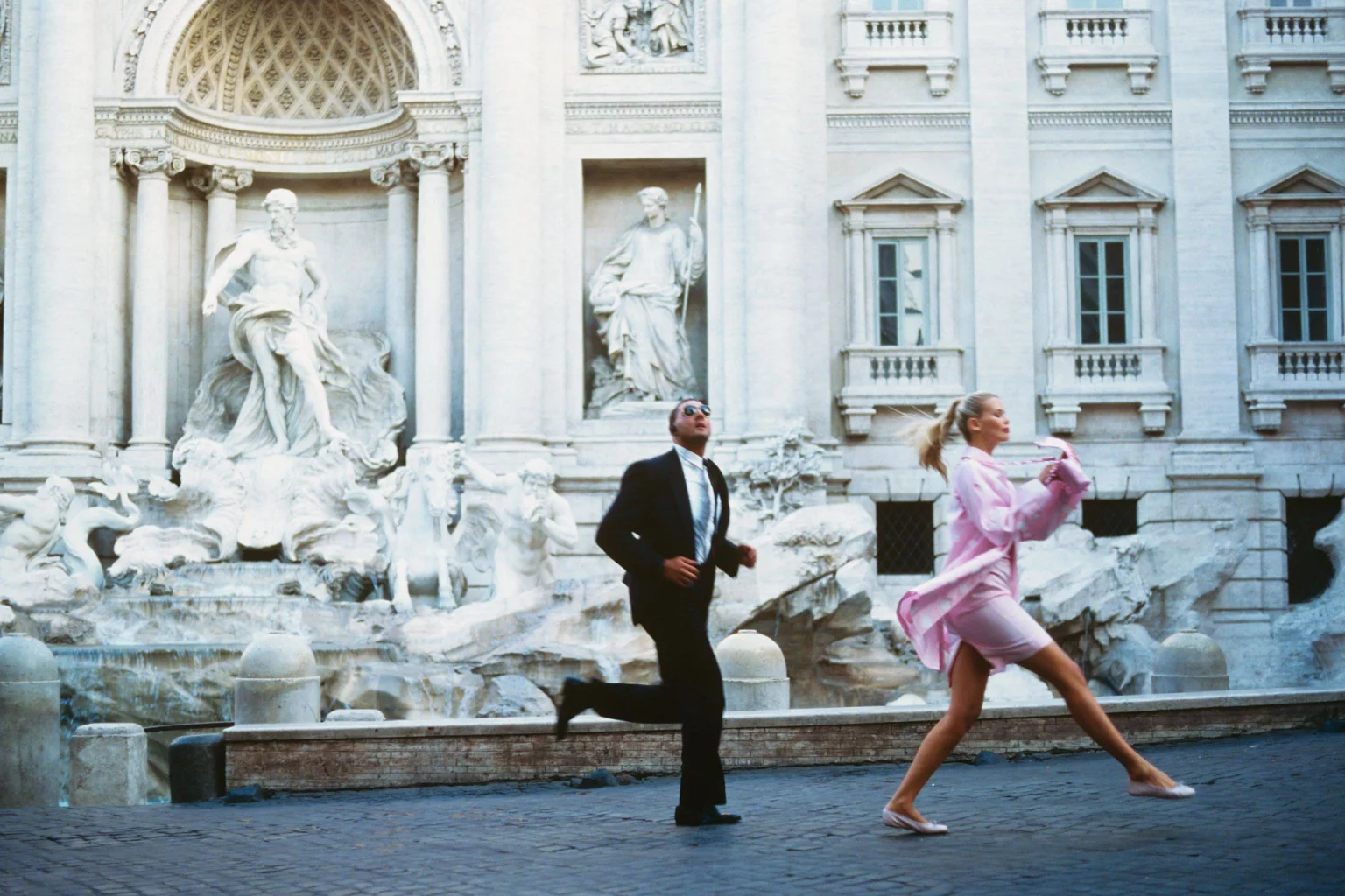 Snow-capped mountain peaks against a pastel sky