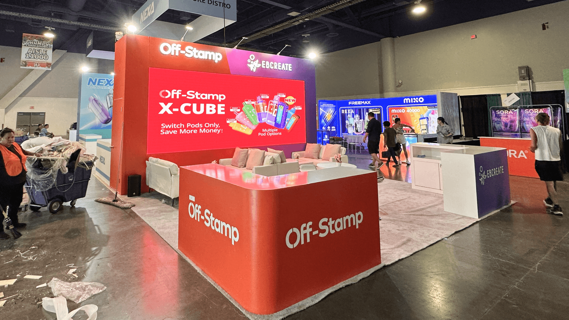 Geekbar CHAMPS Las Vegas 2025 20x60 booth at LVCC – LED content wall setup and cable management for pod system showcase.