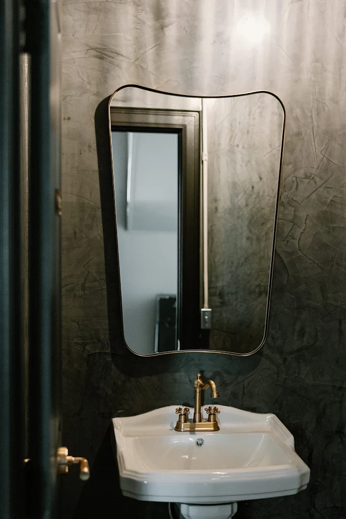 Washroom interior at The Press Pilates showcasing refined finishes and cohesive design details that extend the studio brand