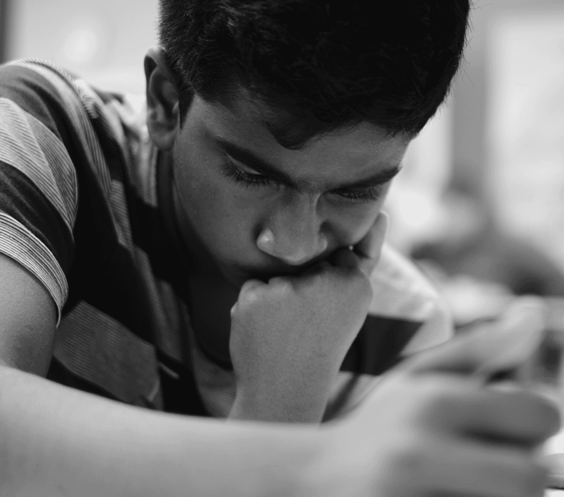 Photo of kid playing chess