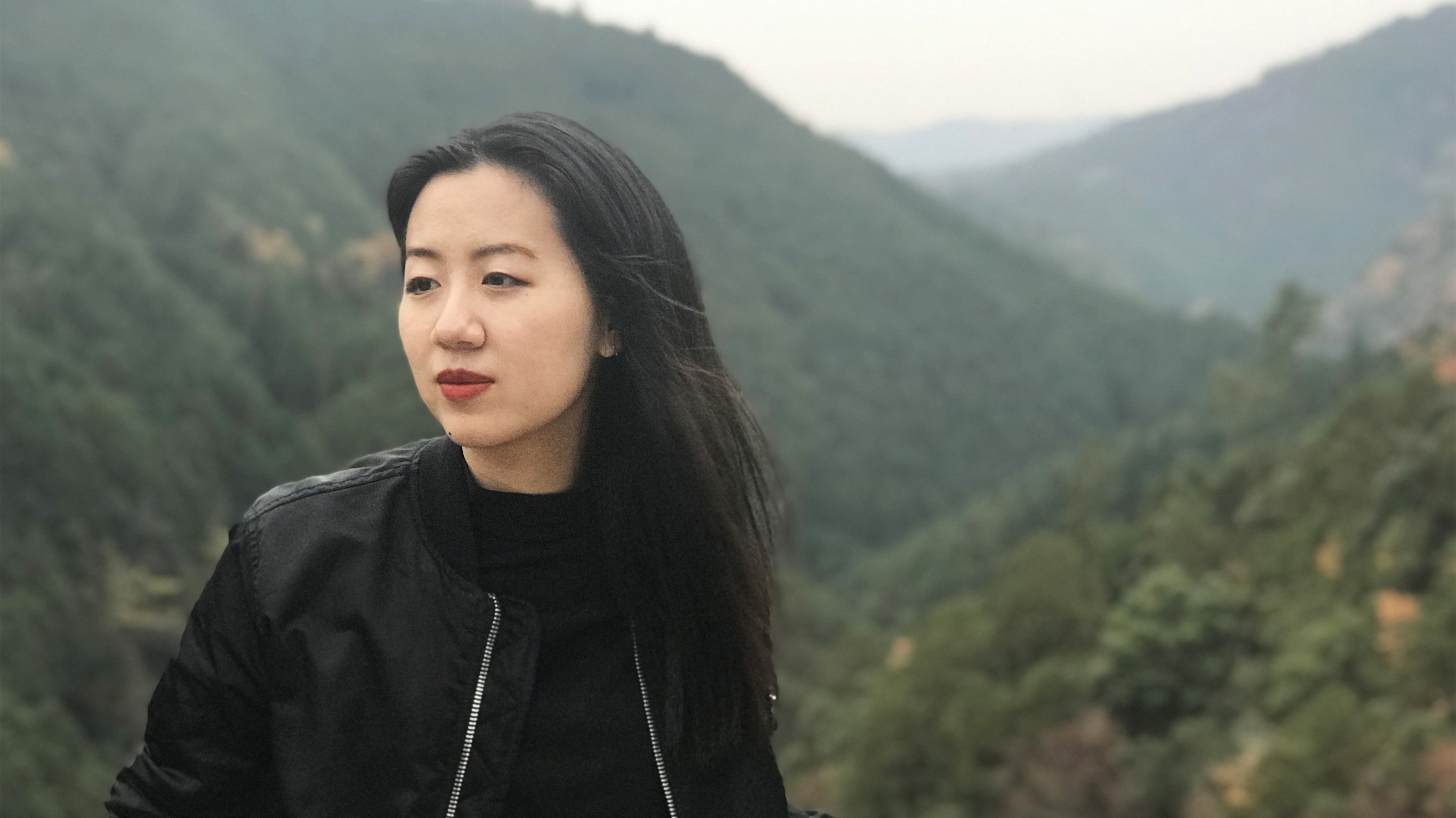 portrait of Tiffany Pai with hills in the background