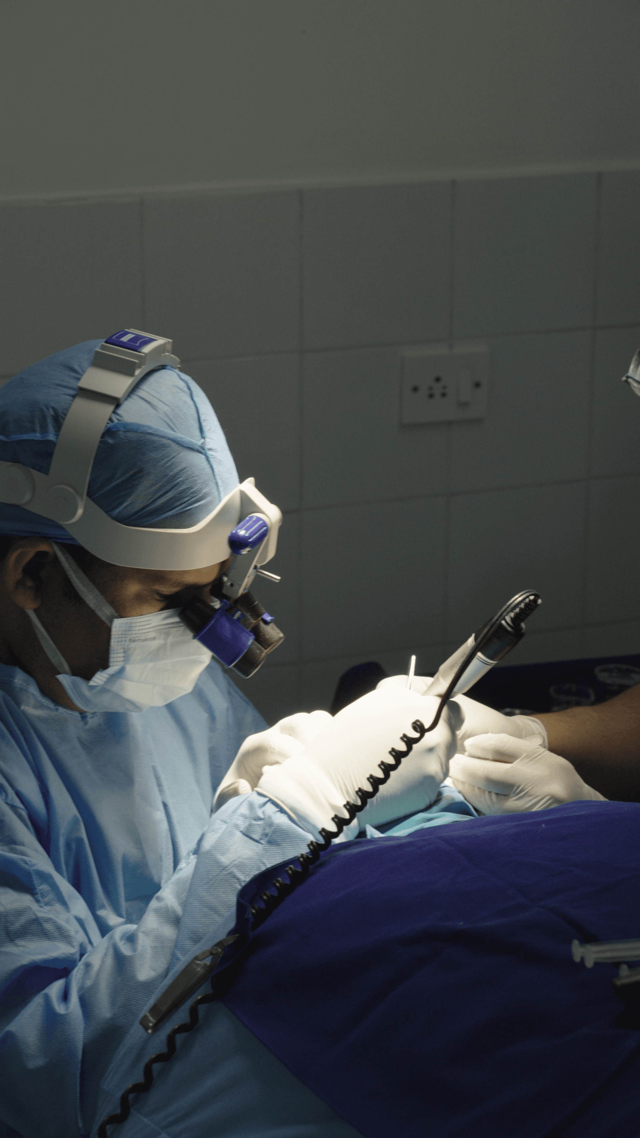 Close-up of glossy lips and white teeth.