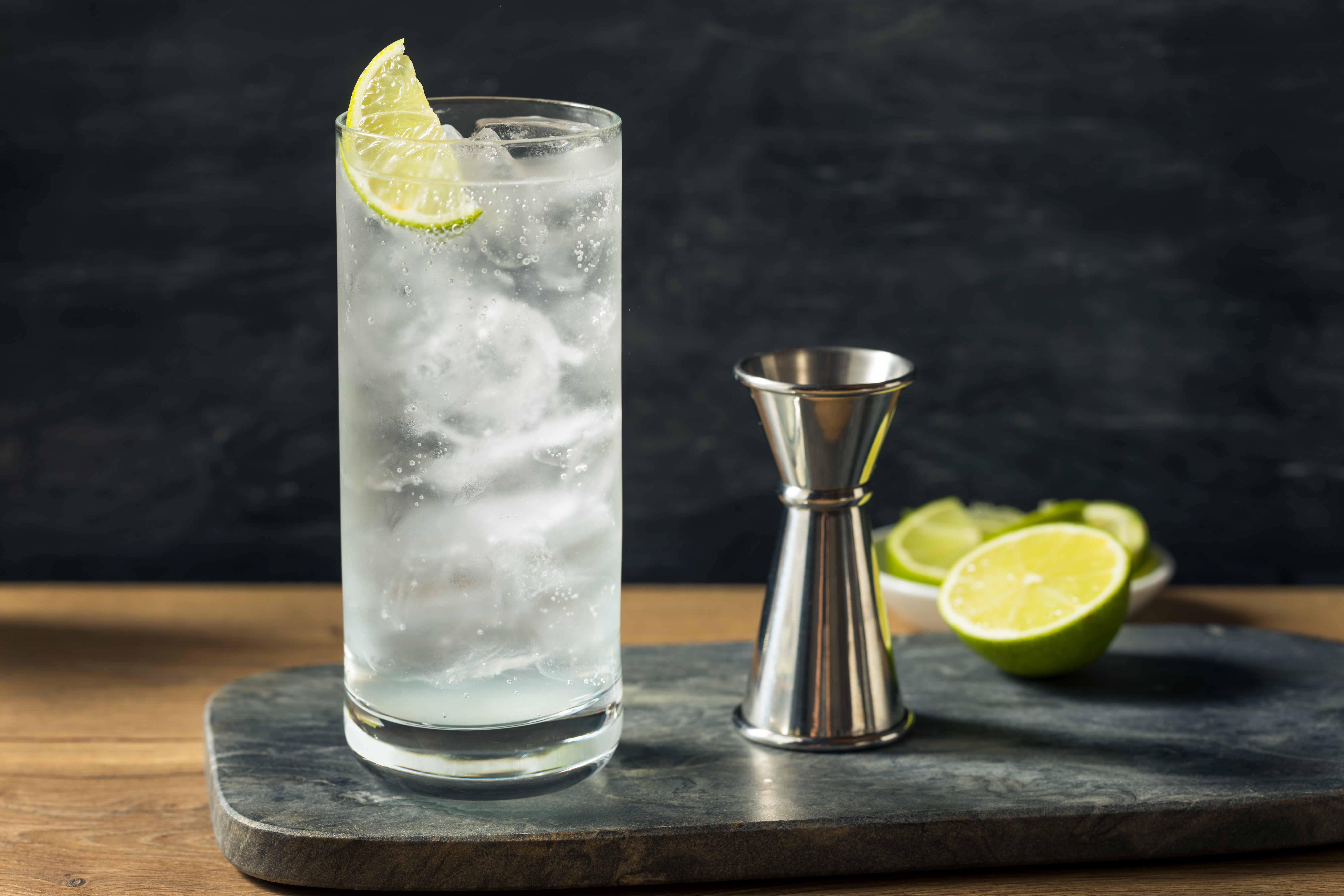 A NEFT Barrel and a glass of Vodka Tonic on a bar counter.