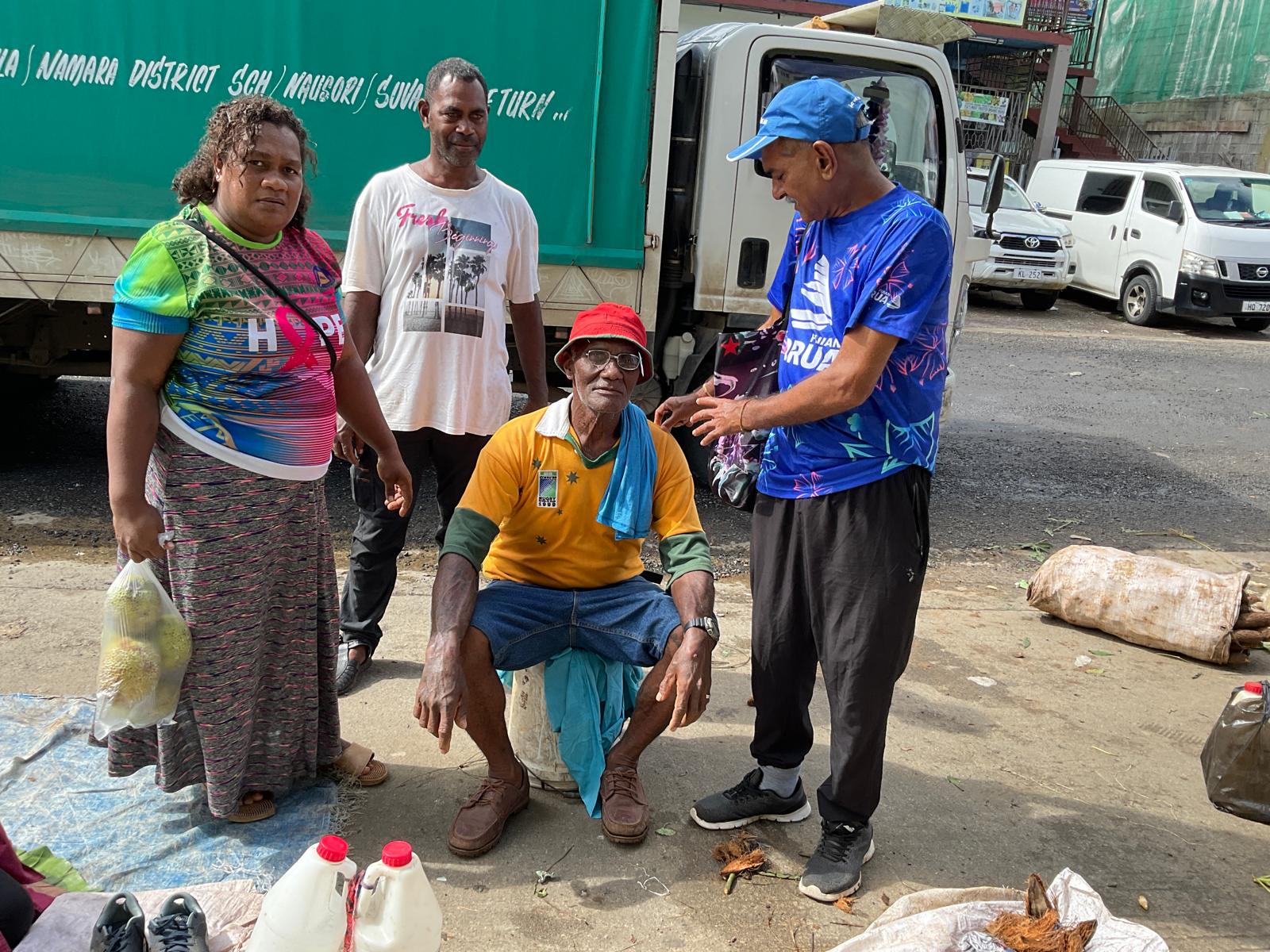 a group of children sitting on steps in front of a building