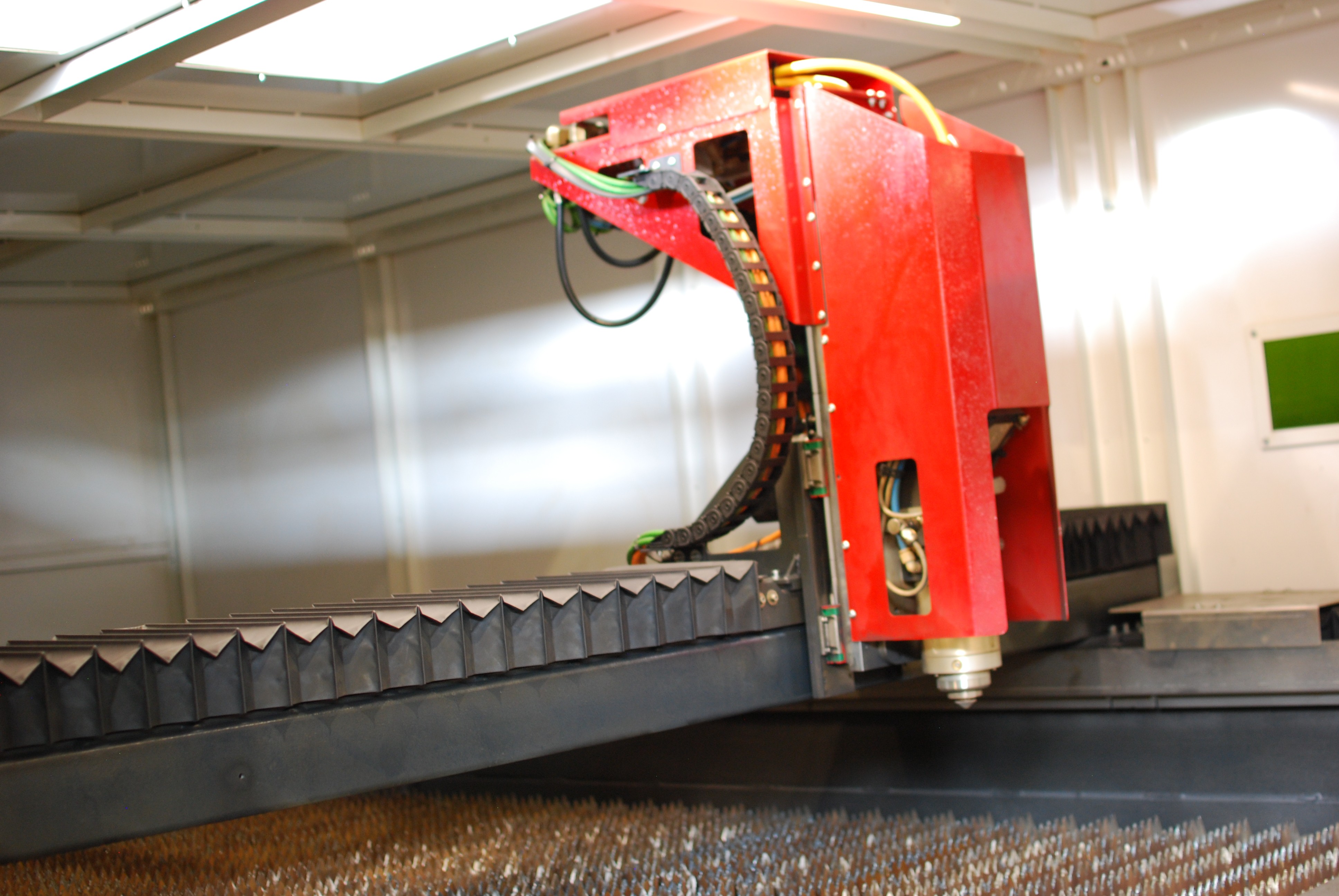 a man welding a piece of metal in the dark