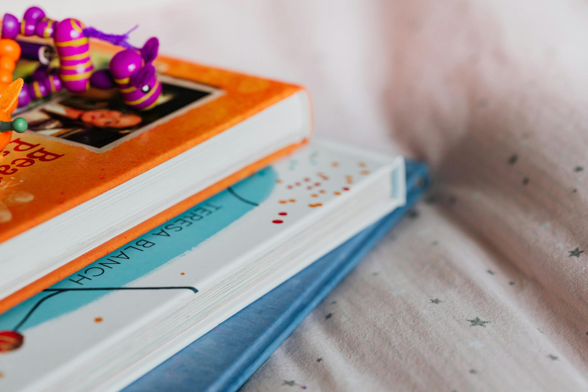 A wooden bookshelf filled with diverse children's literature, showing colorful spines and various genres.