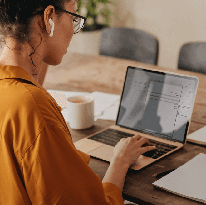 business setup companies in dubai - women using tab