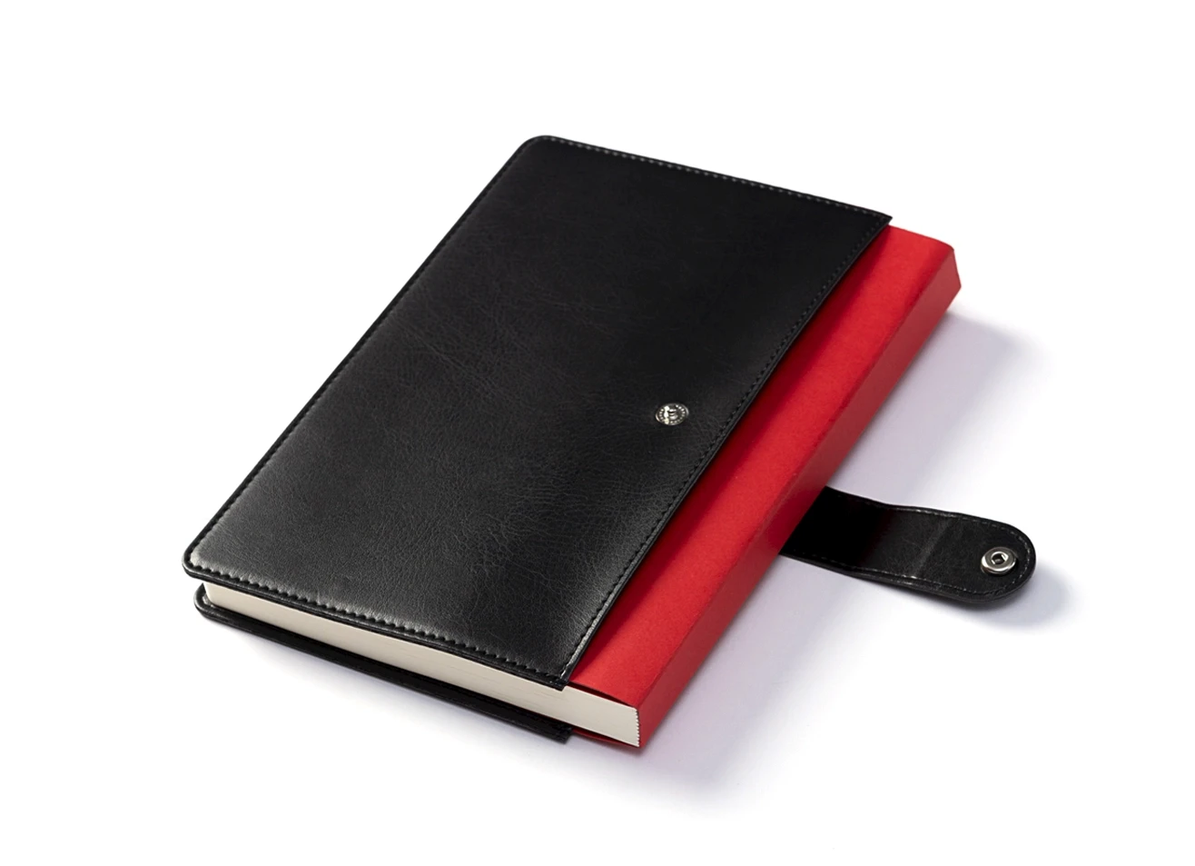 Angled view of black cover with red notebook insert and open strap.