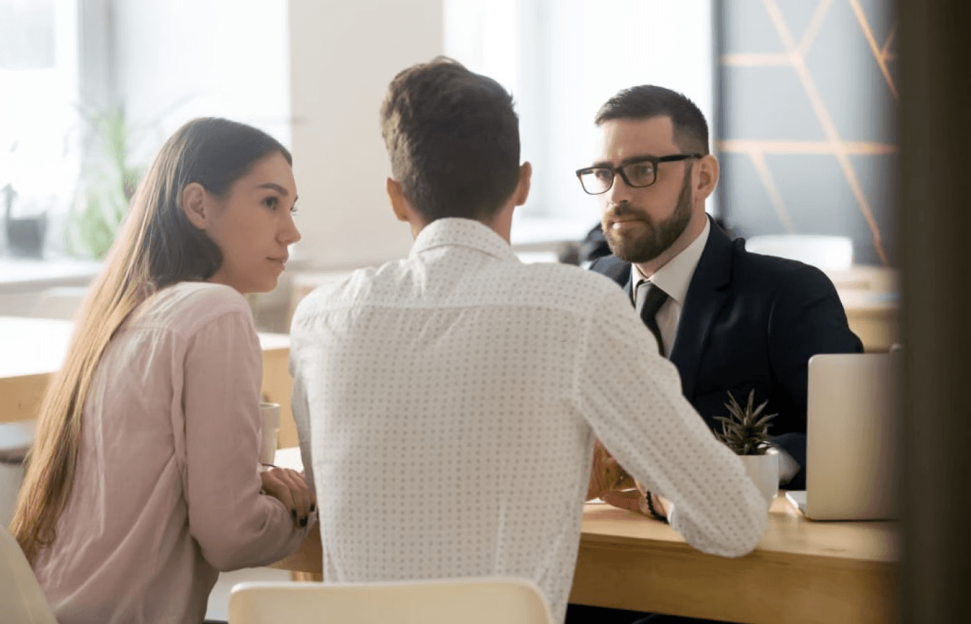 Young couple chatting with a lawyer