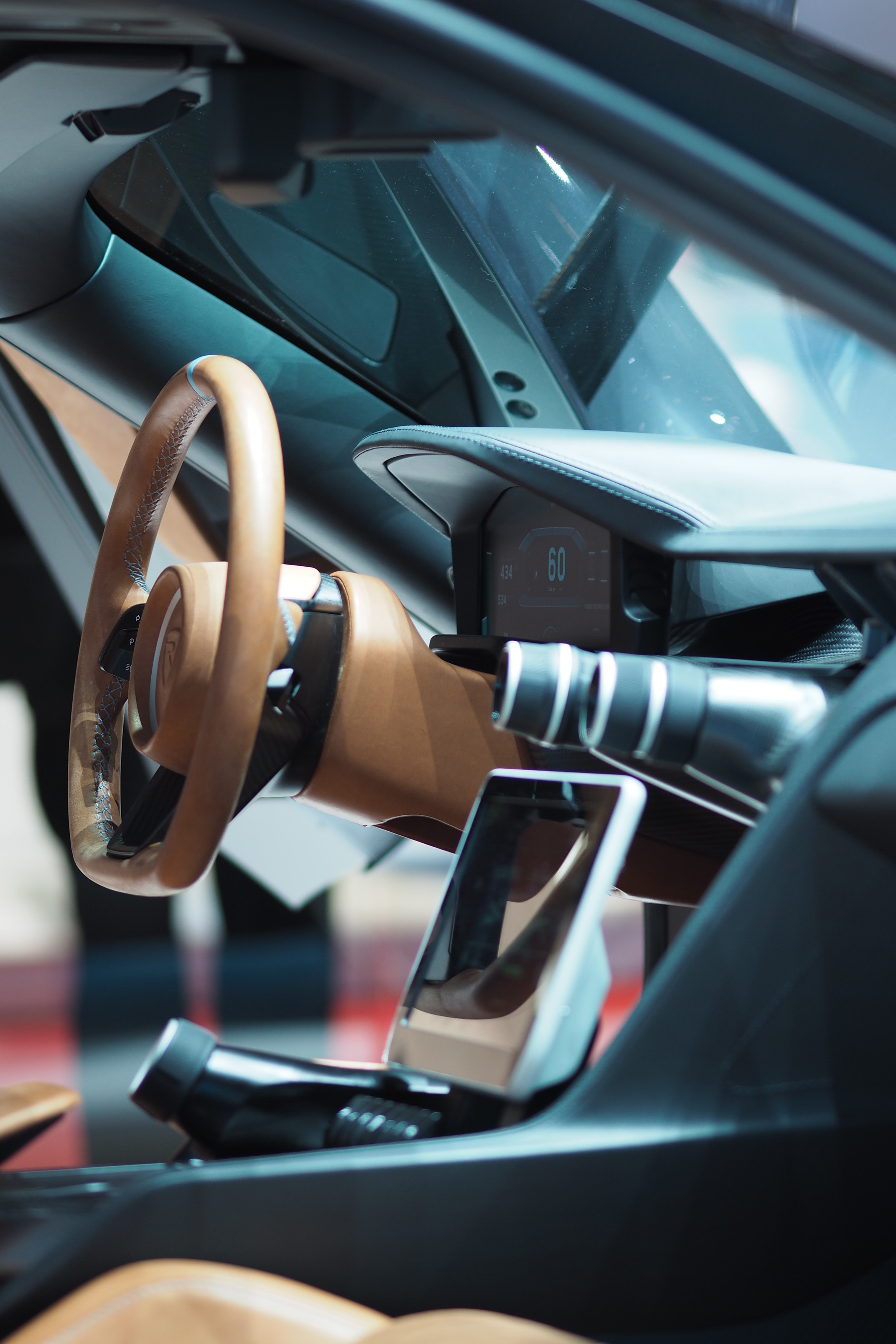 Rimac Nevera car interior focused on centre console and steering wheel.