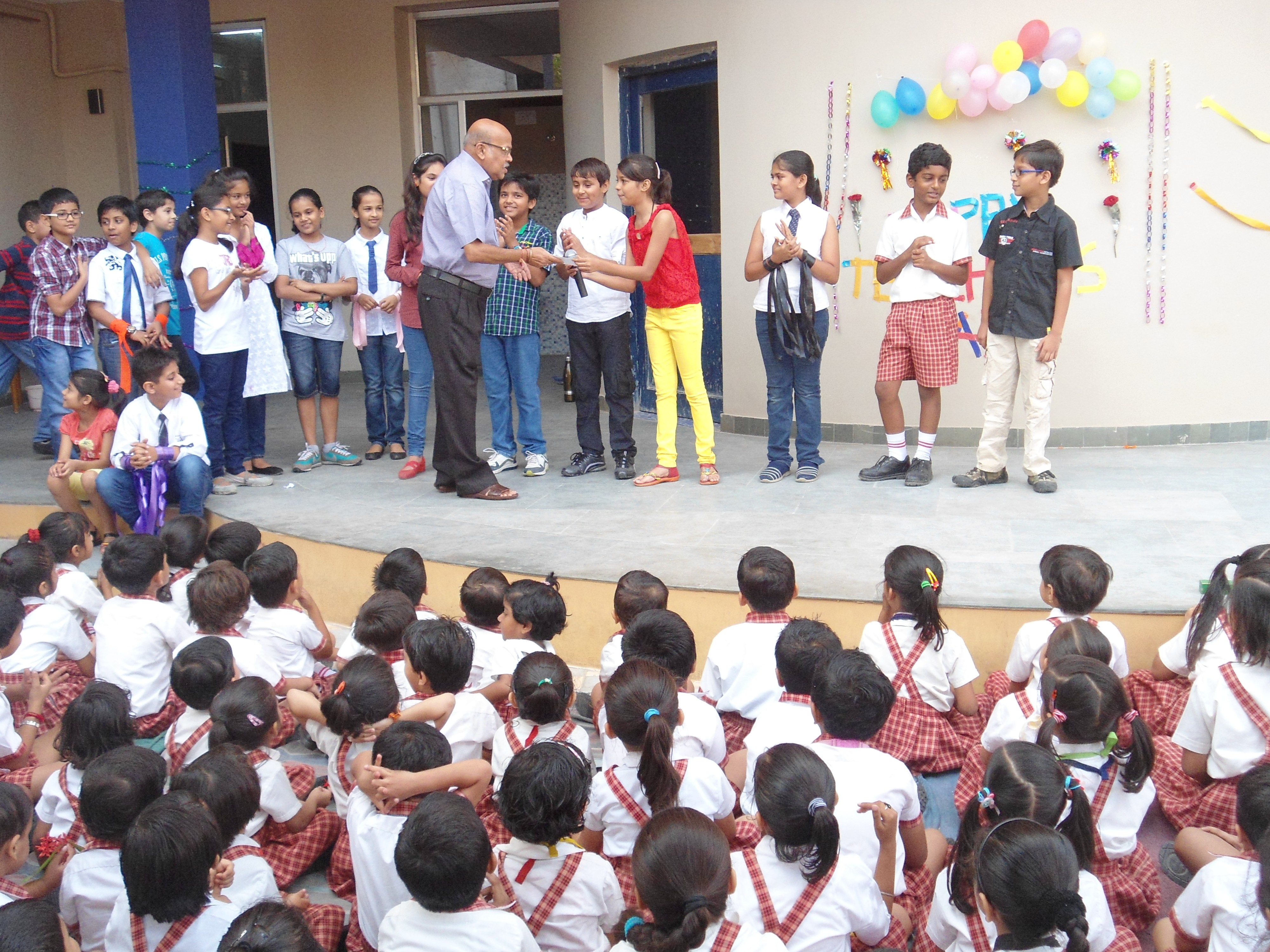 A vintage school bus is driving down the road