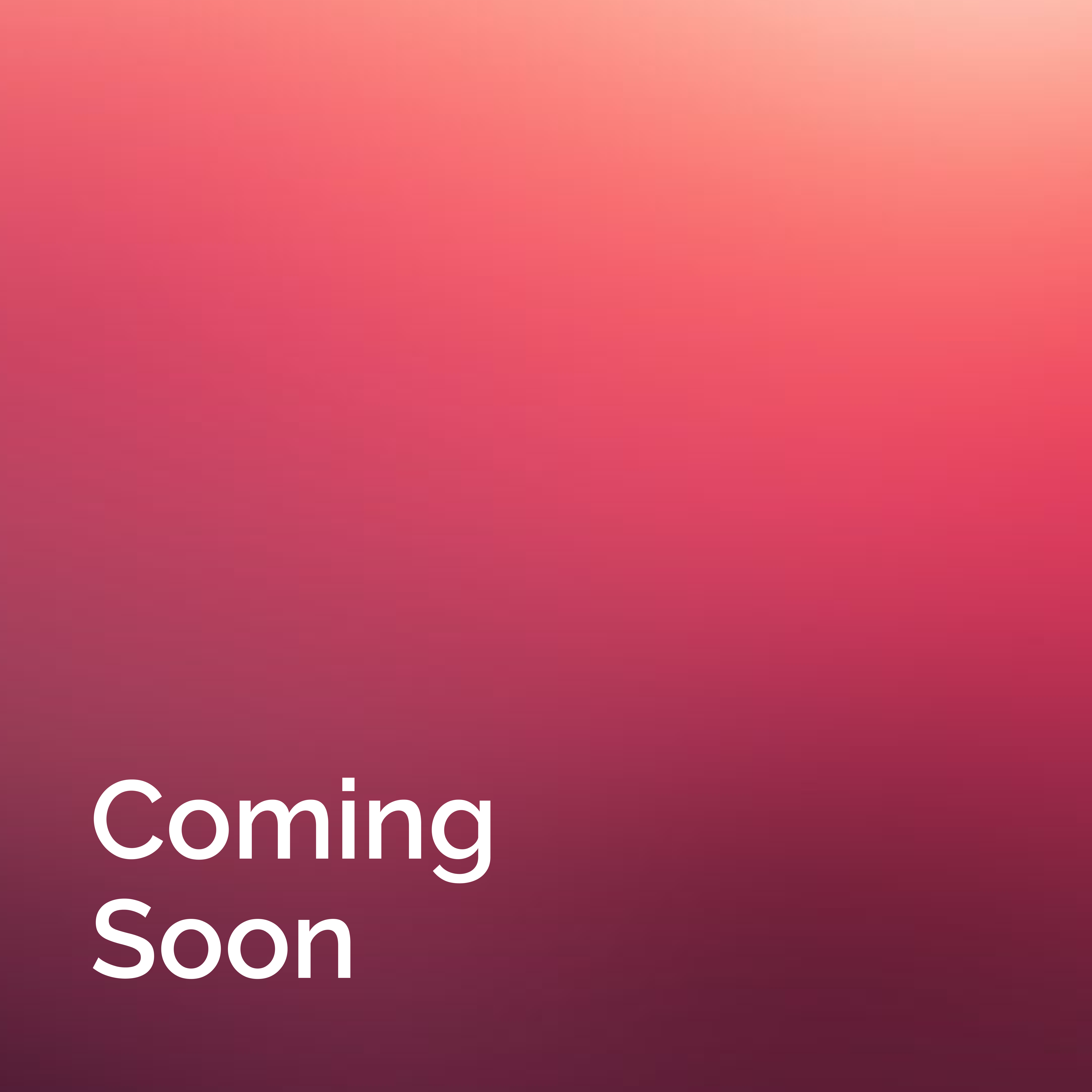 man wearing grey t-shirt standing in front of man sitting on chair