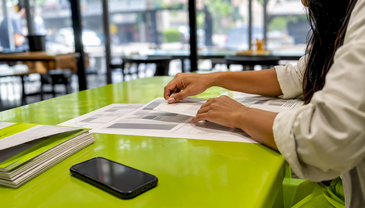 Hands arranging dynamic ad copy templates