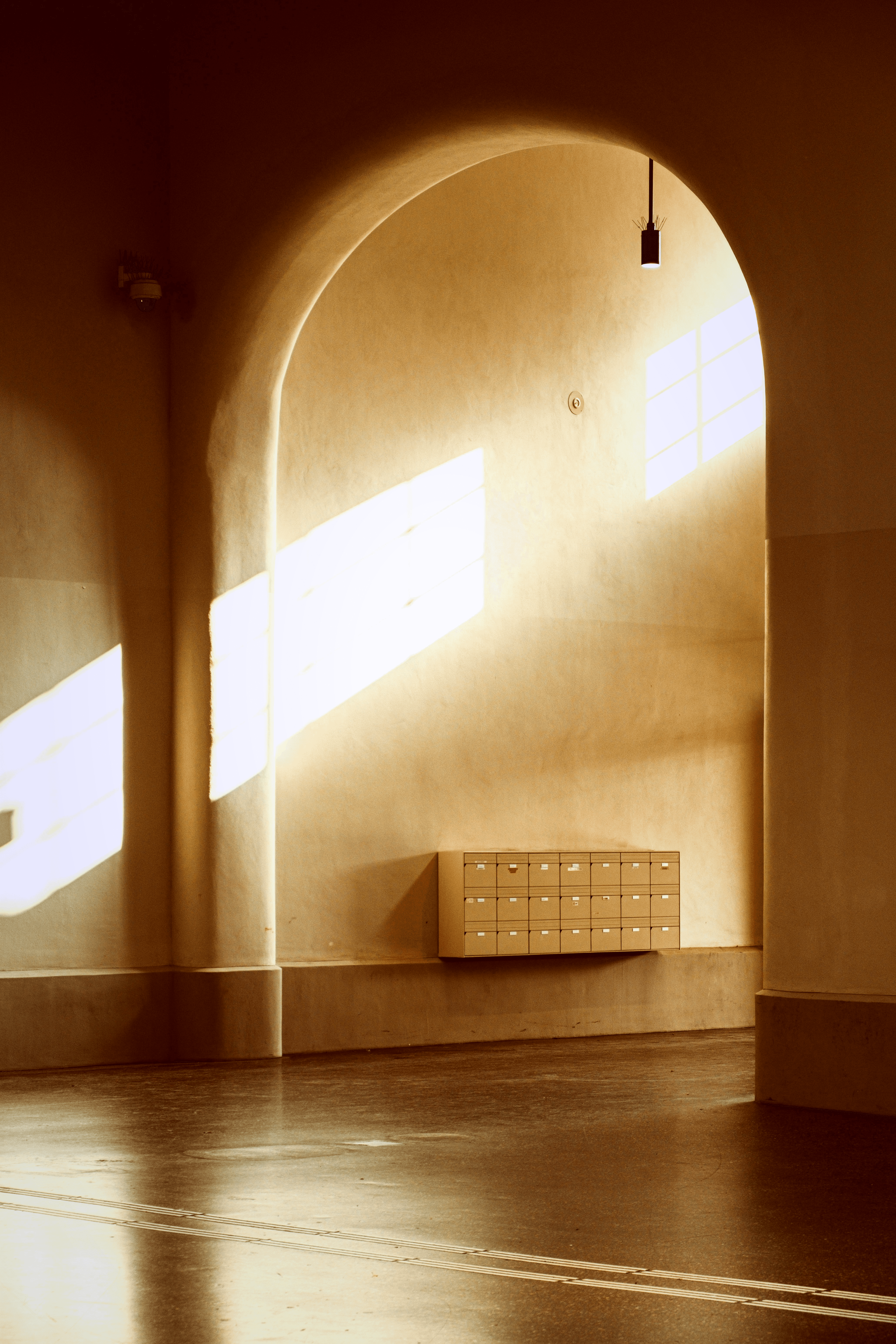 Sunlight streams through windows onto lockers