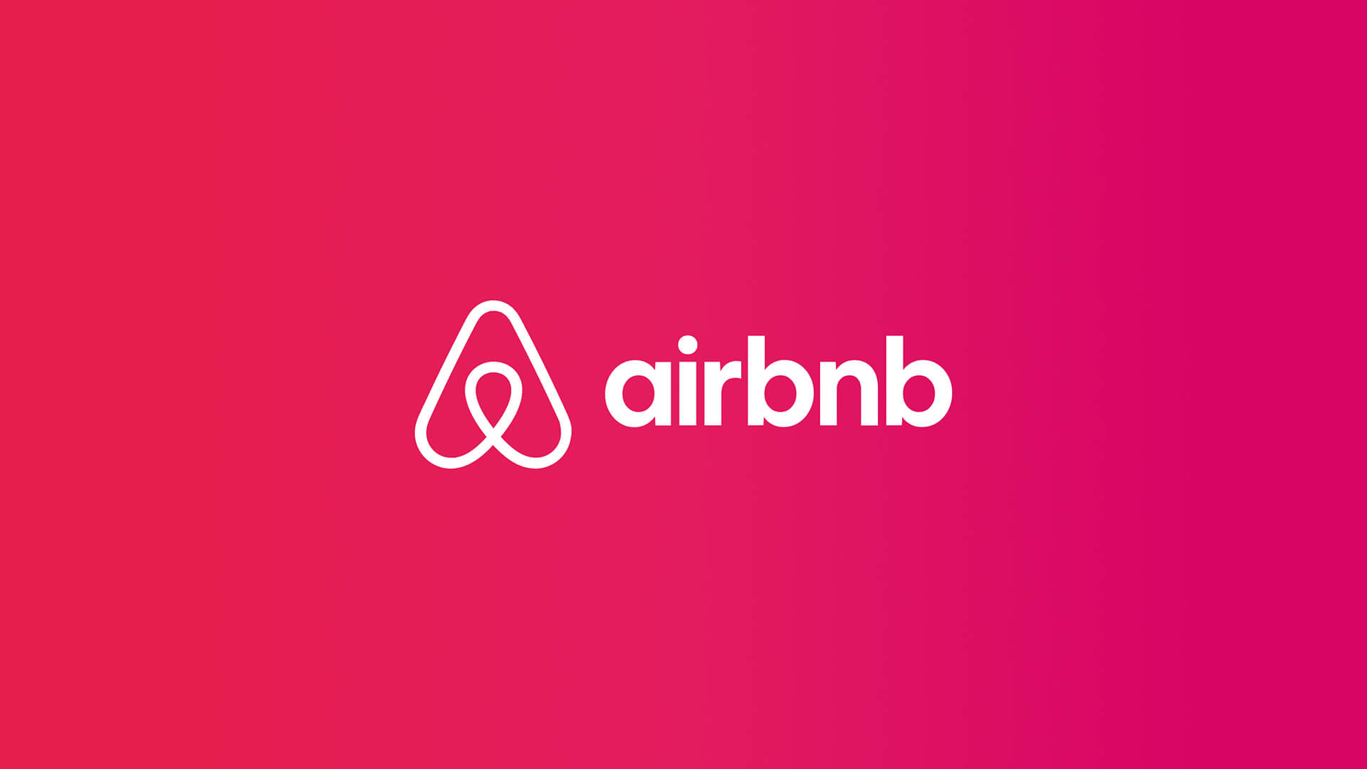 Airbnb logo on a pink gradient background showcasing its minimalist brand identity and global recognition