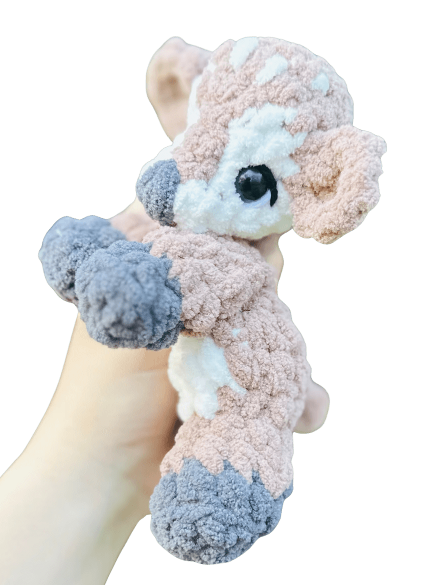 A handcrafted knitted hedgehog toy featuring a soft cream-colored body and intricately detailed, textured brown spines, perfect for children and collectors.