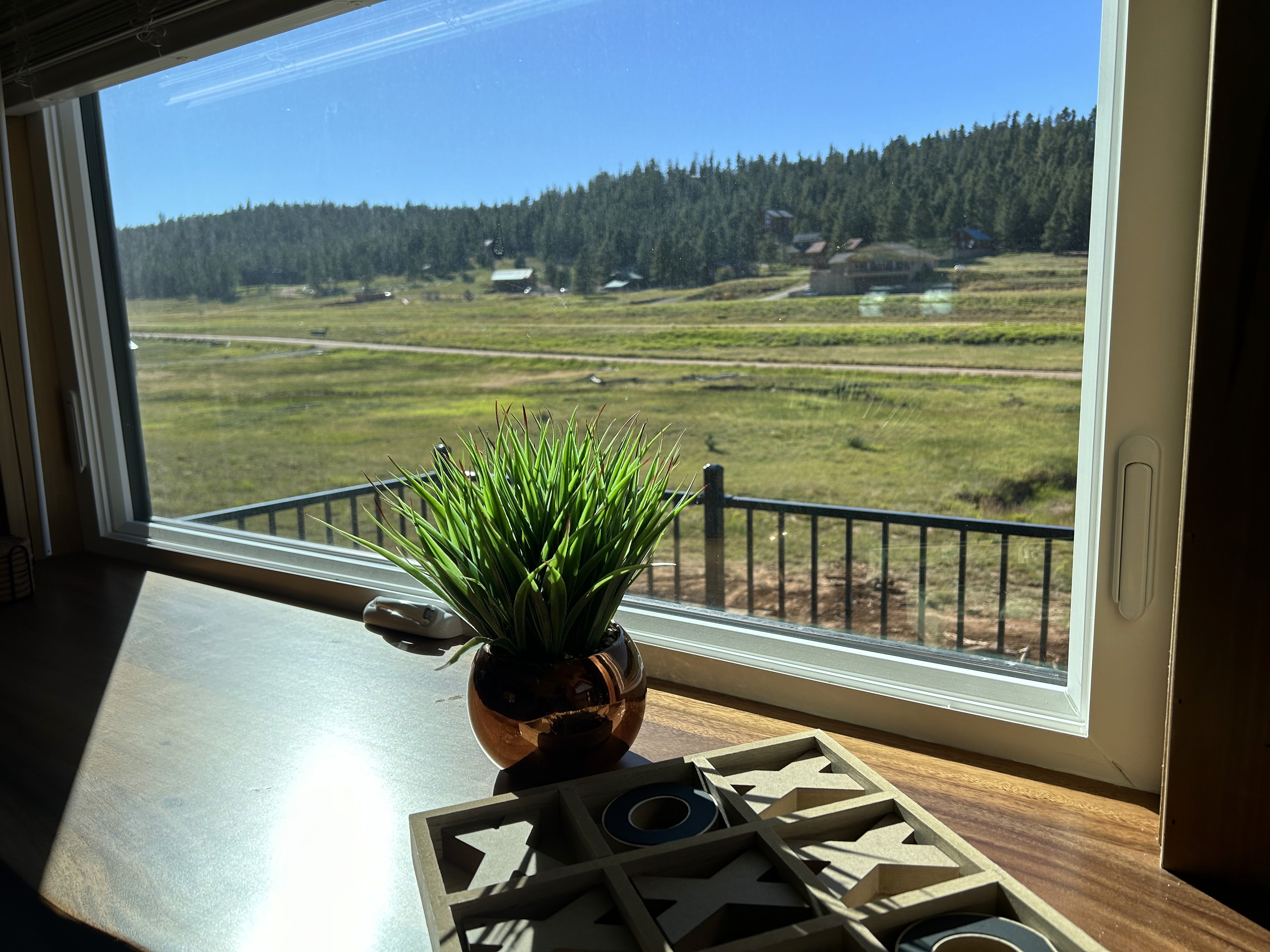 Open-concept kitchen to living area with wood accents and retro-modern design in Southern Utah