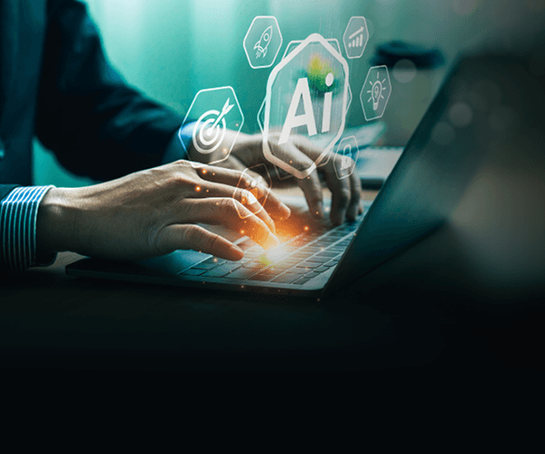 a white robot with blue eyes and a laptop