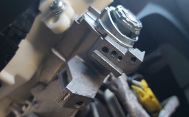 Honda ignition lock removed from steering column for rebuilding process