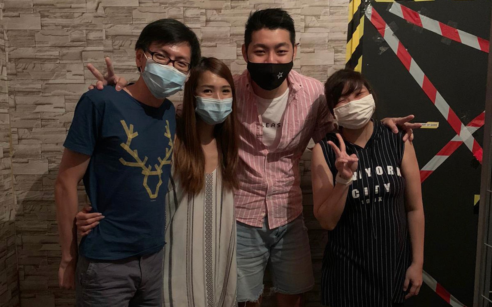Group of people posing at Trapped Escape Room in Singapore.