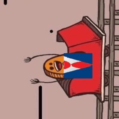 Smiling man in a blue beanie and black hoodie against a brick wall, exuding a joyful and relaxed vibe.