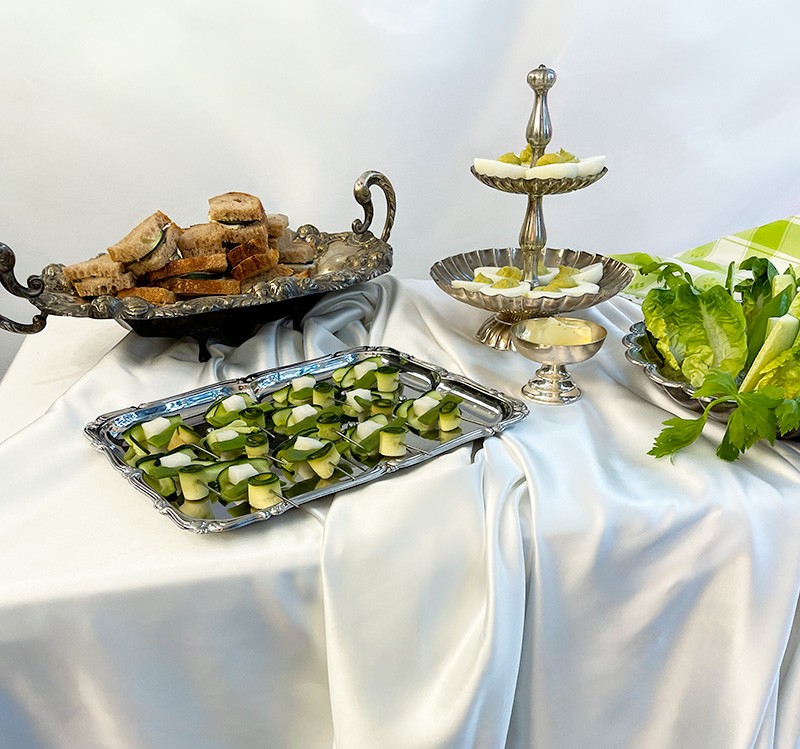 a small animal sitting on top of a large rock