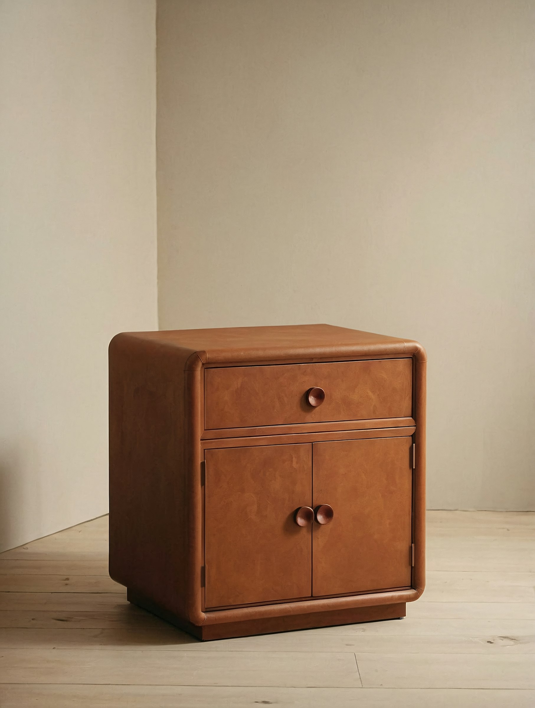 Stylish caramel-brown wooden nightstand with rounded edges, a drawer, and a cabinet. Perfect for minimalist and modern interiors.