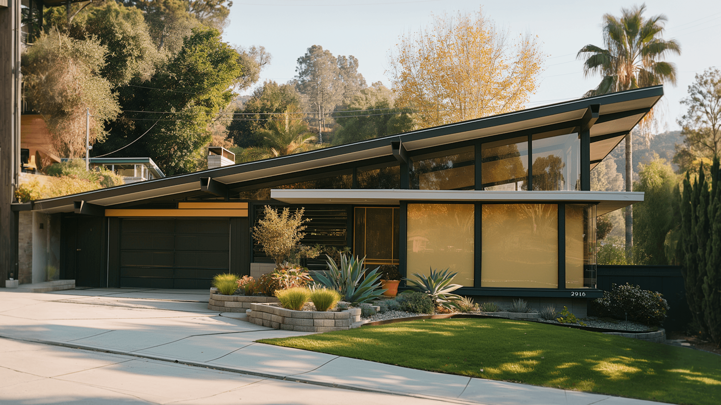 Modern house with large windows, a sloped roof, and landscaped garden, set amidst trees and greenery.