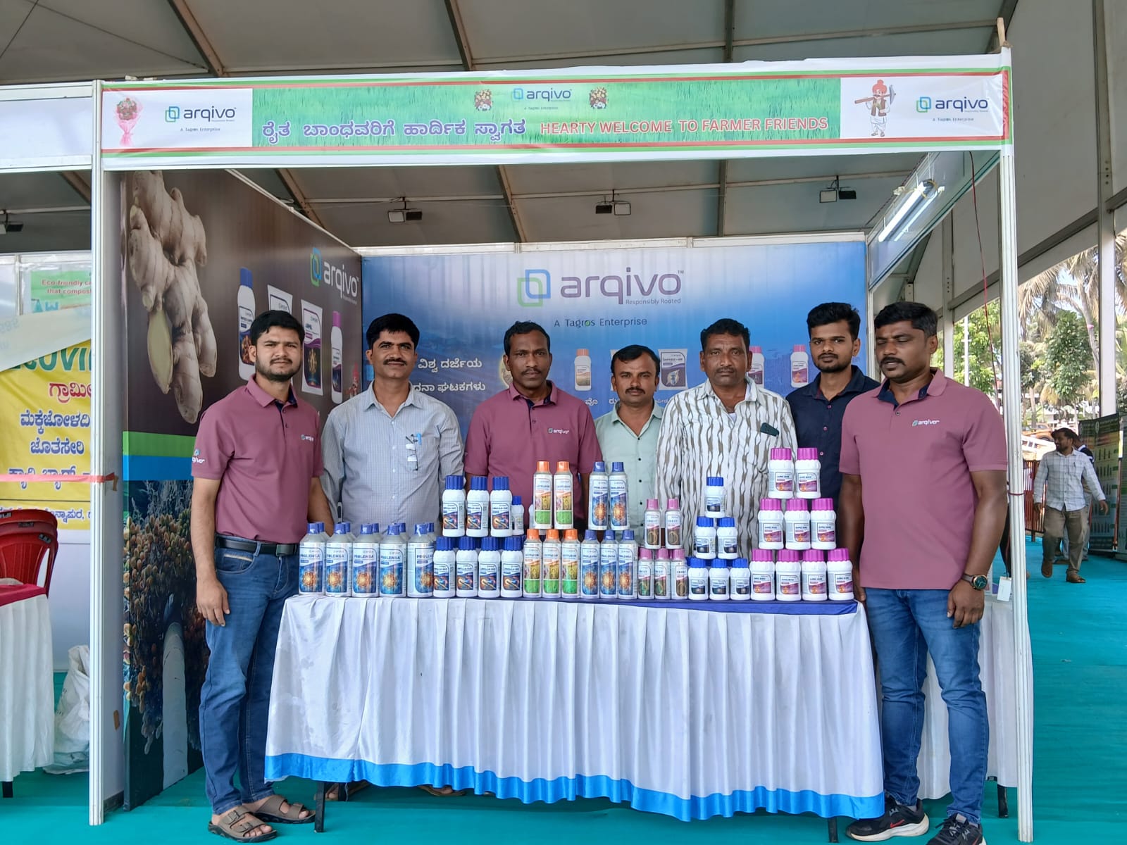 A man stading with Surfboard